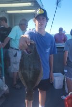 a person holding a fish