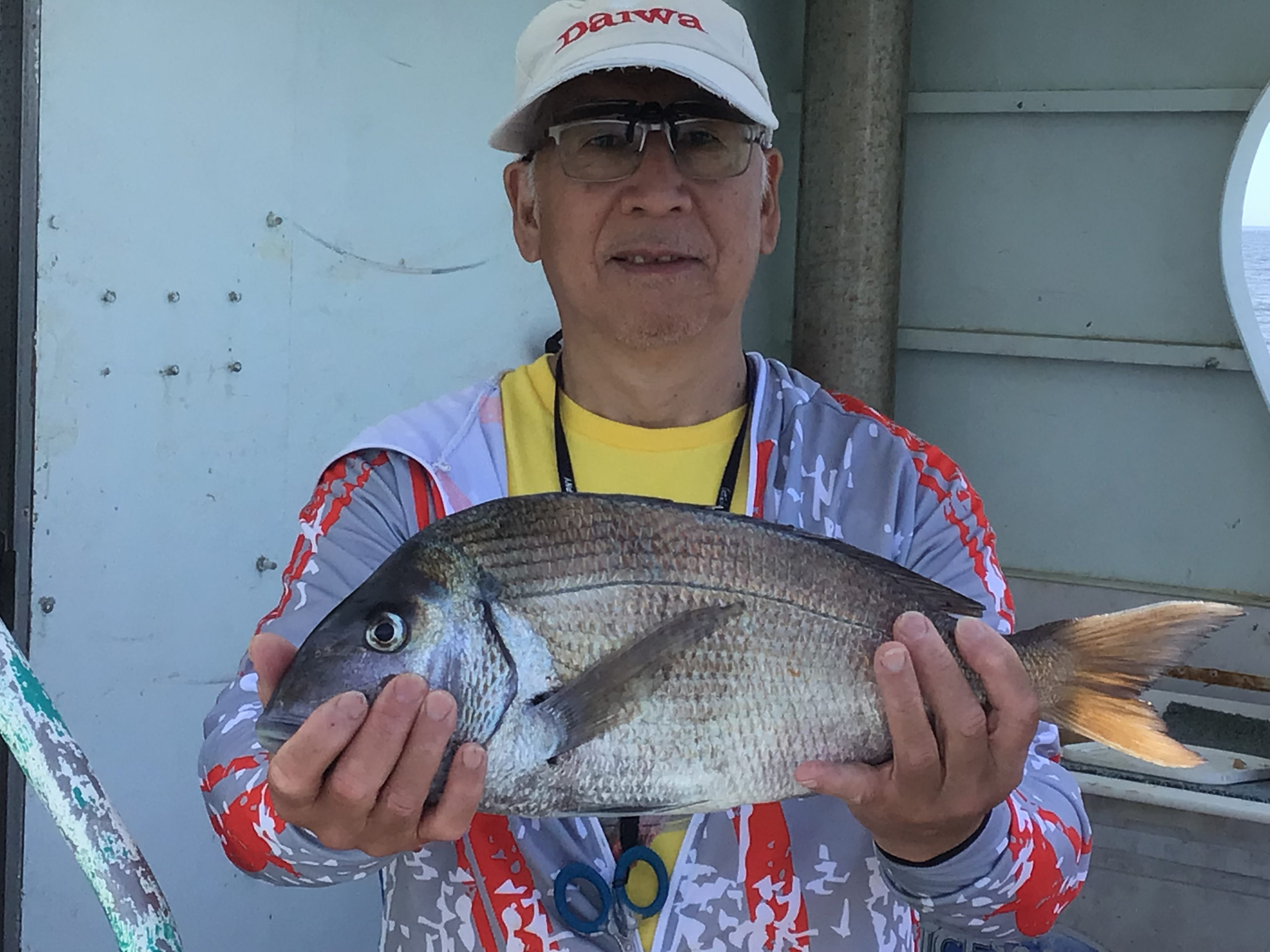 a man holding a fish