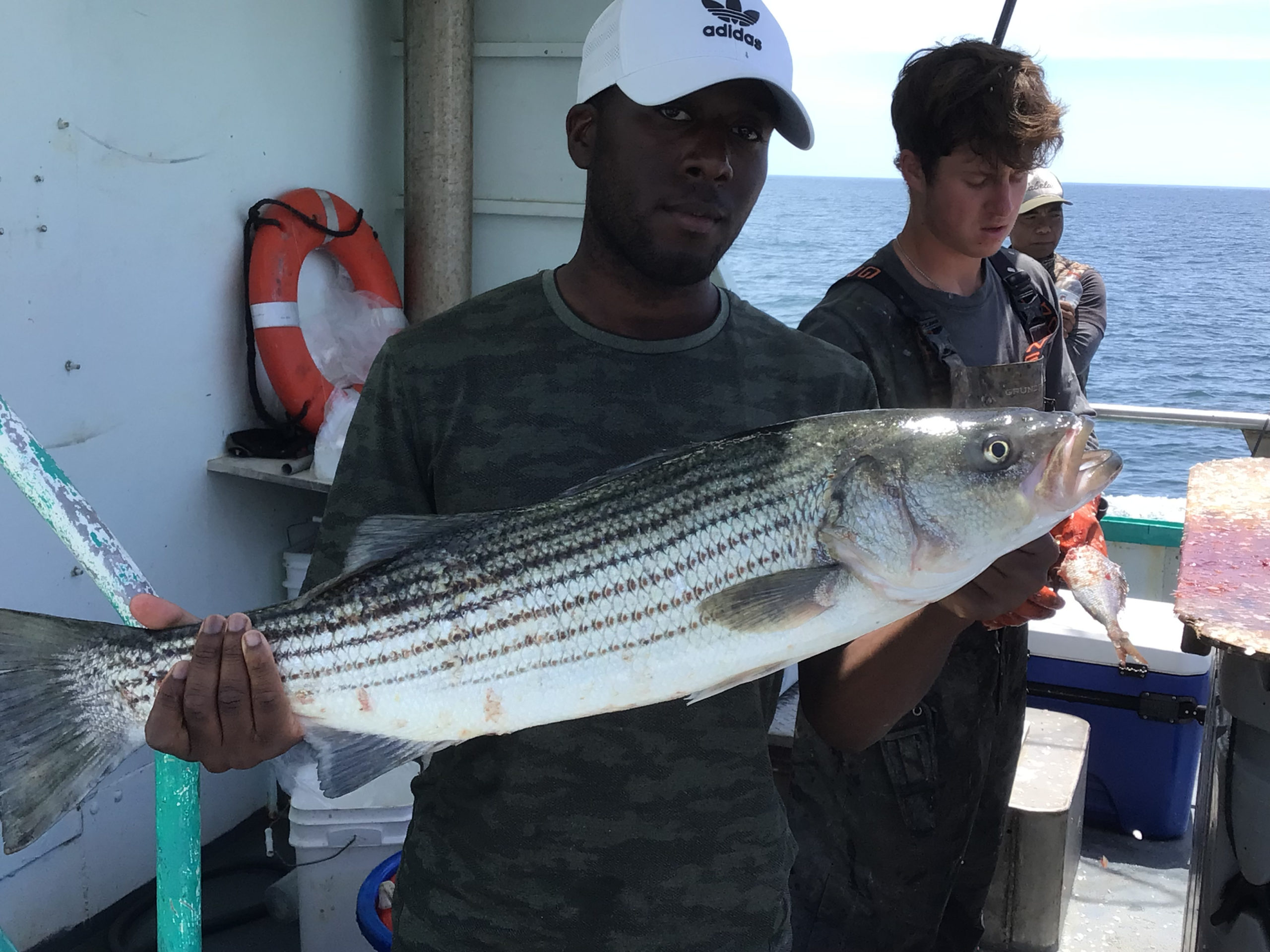 a person holding a fish in the water