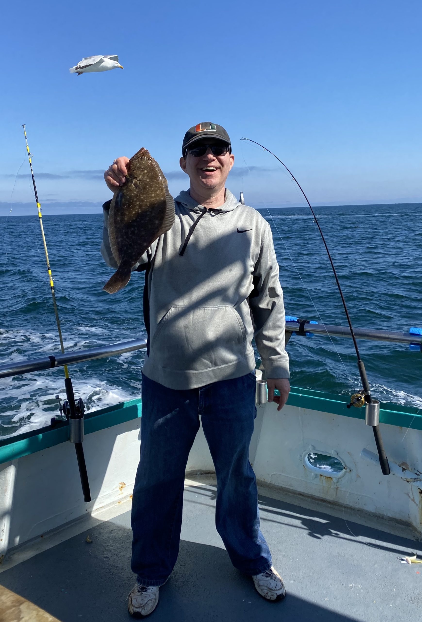 a person standing next to a body of water