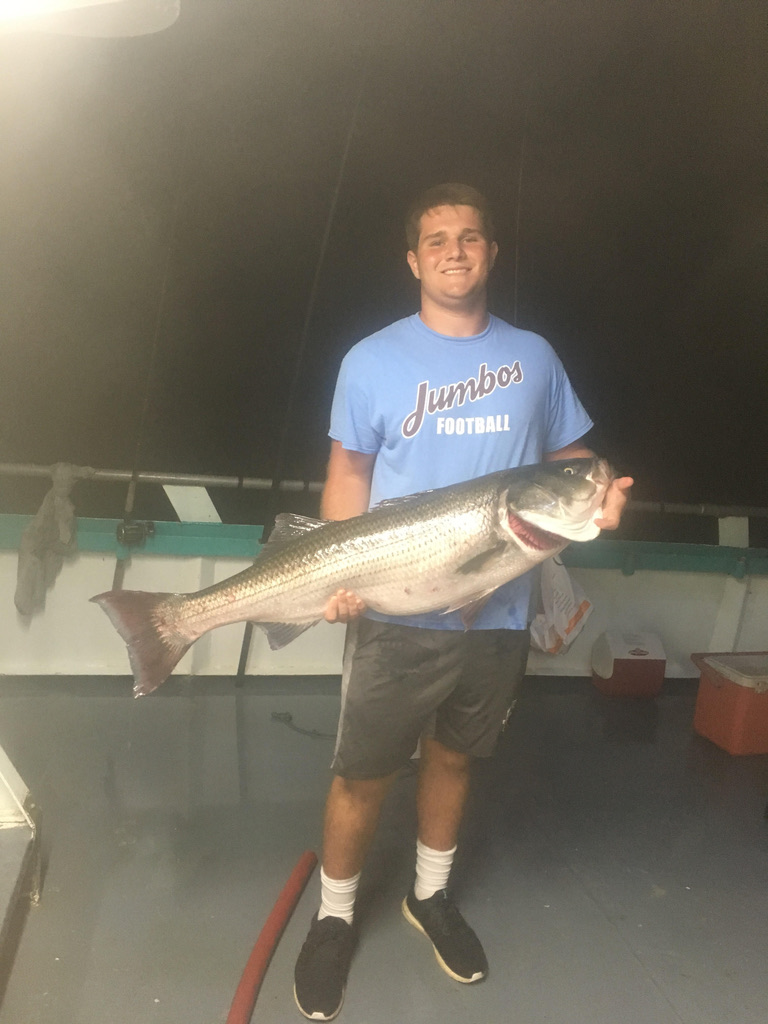 a man holding a fish
