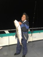 a person holding a fish