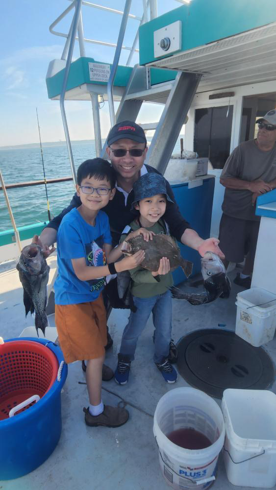 a group of people standing on a boat