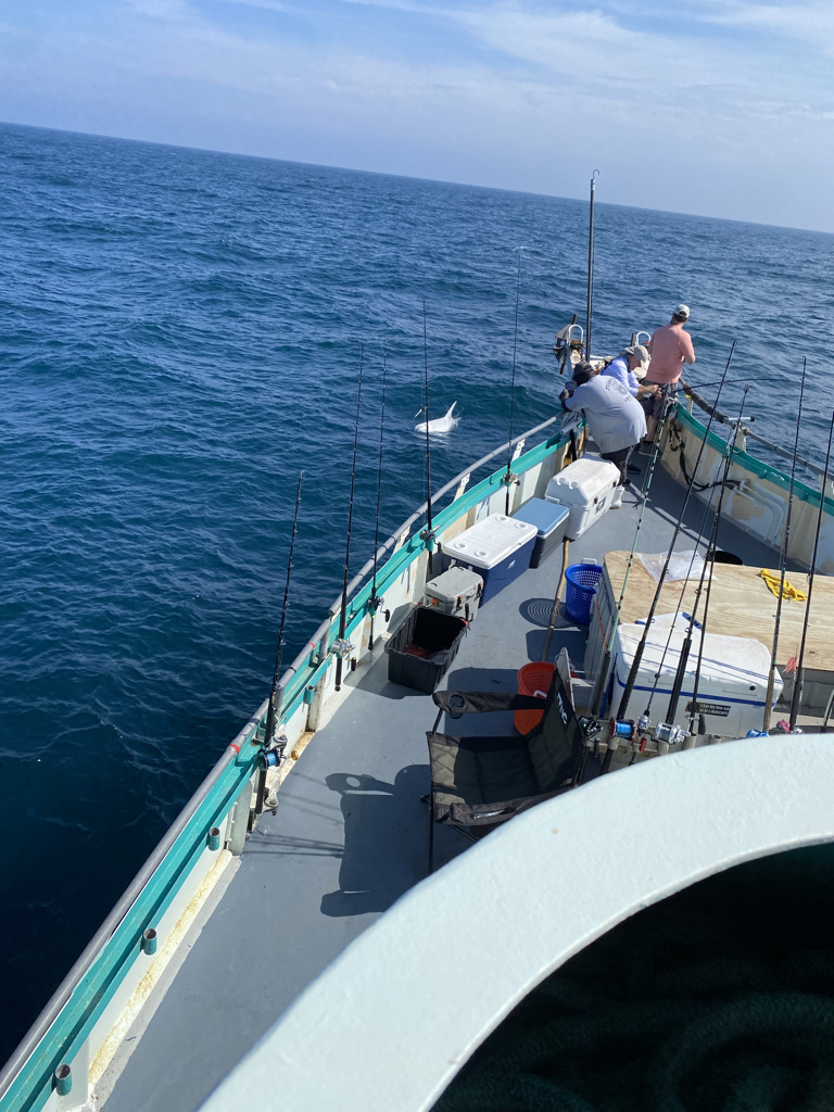 a group of people in a boat on a body of water