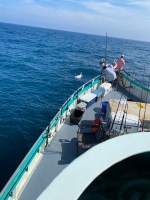 a group of people in a boat on a body of water