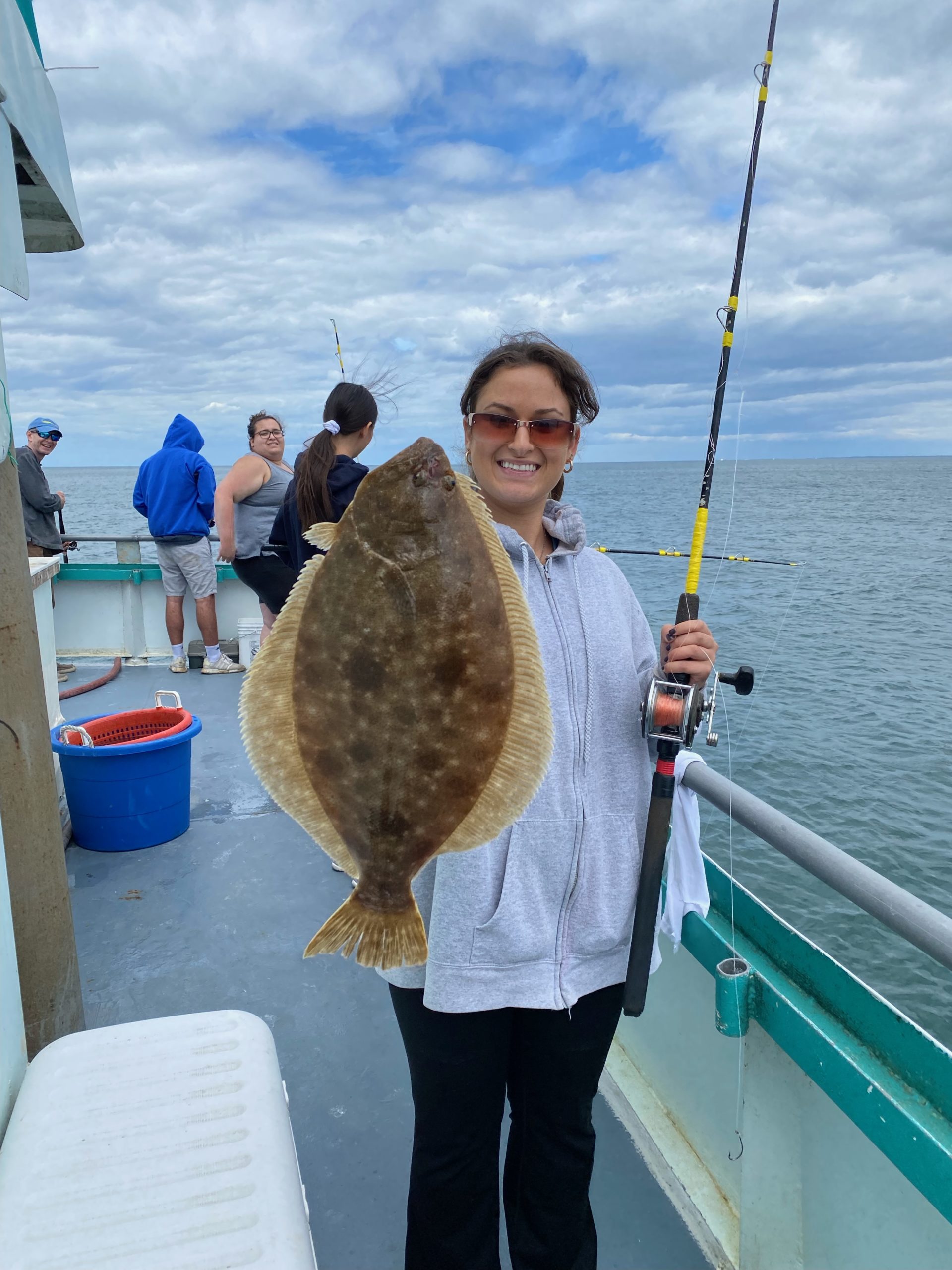 a man and a woman standing next to a body of water