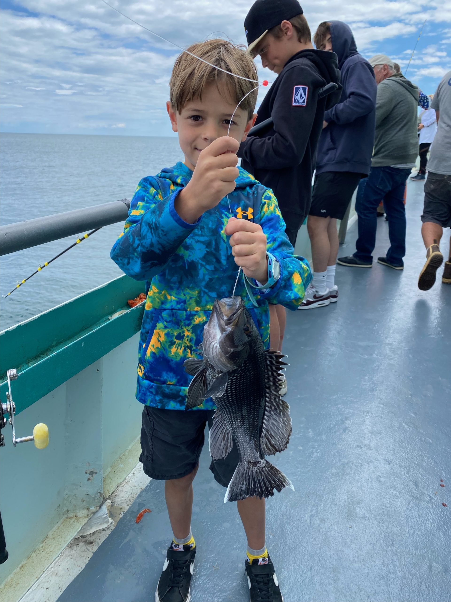 a little boy that is standing in the water