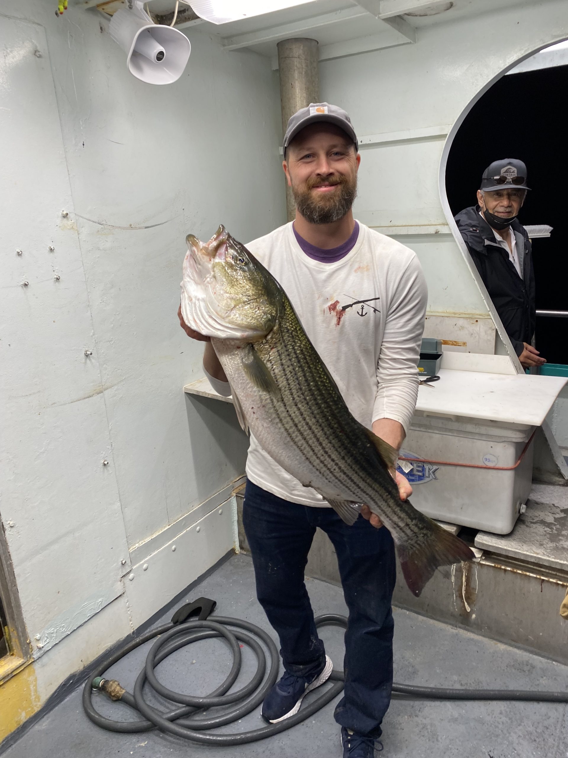 a man holding a fish