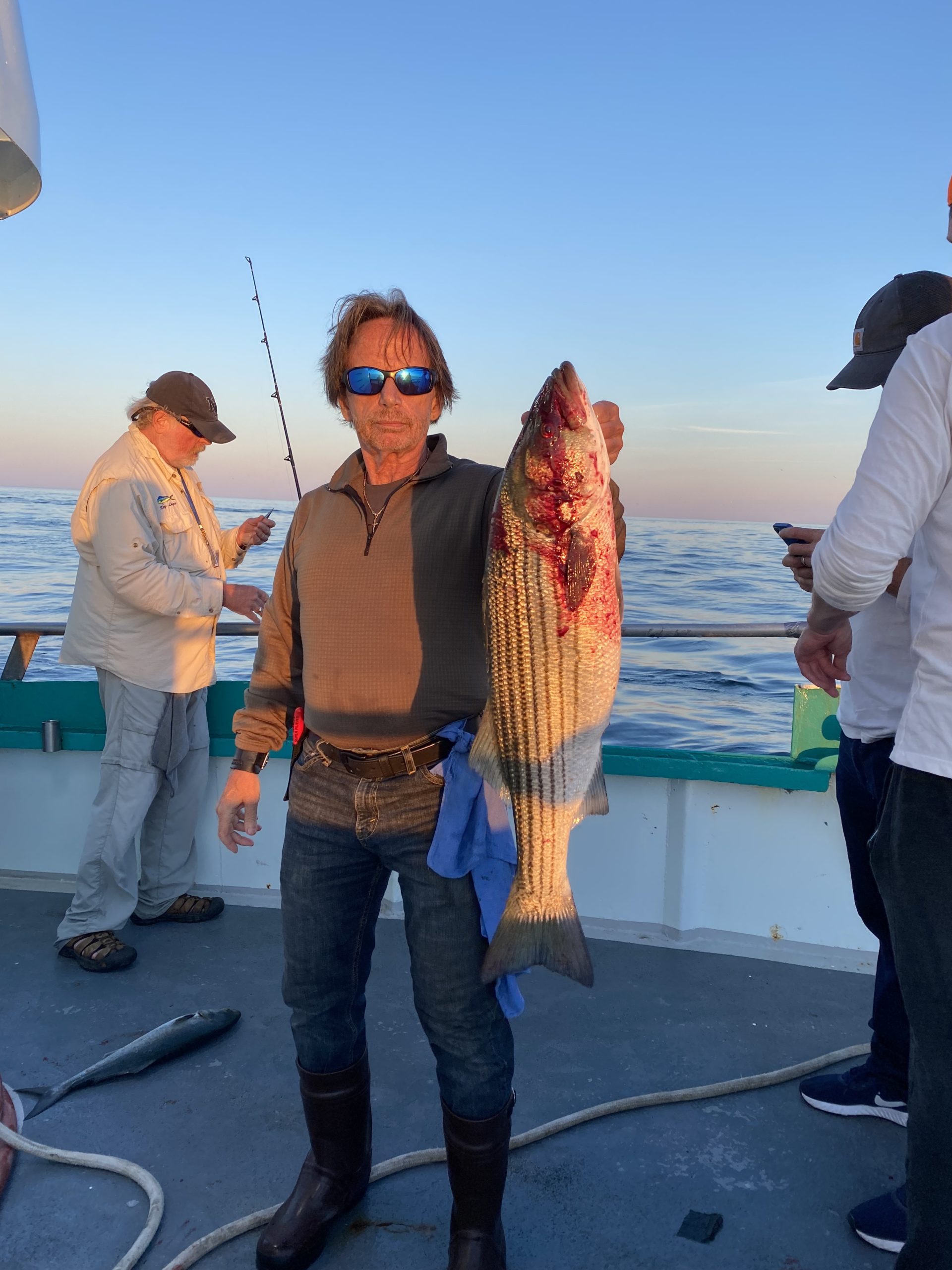 a couple of people that are standing in the water