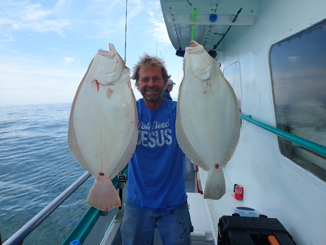 a person holding a fish in the water