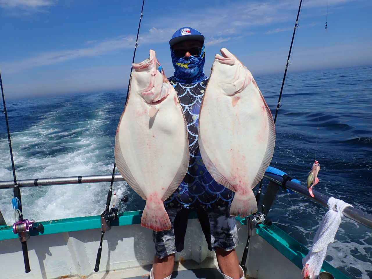a man holding a fish in the water