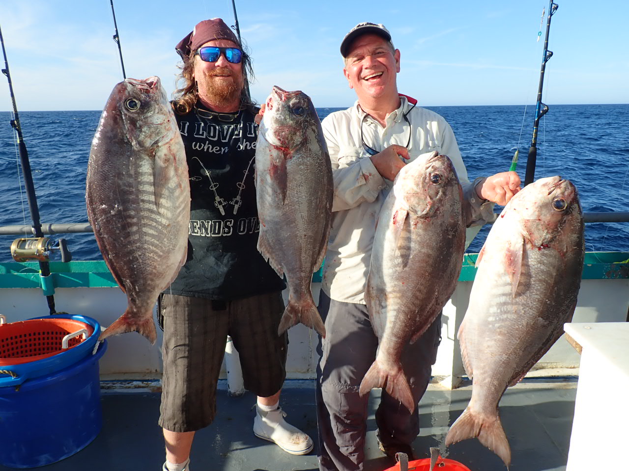 a man holding a fish in the water