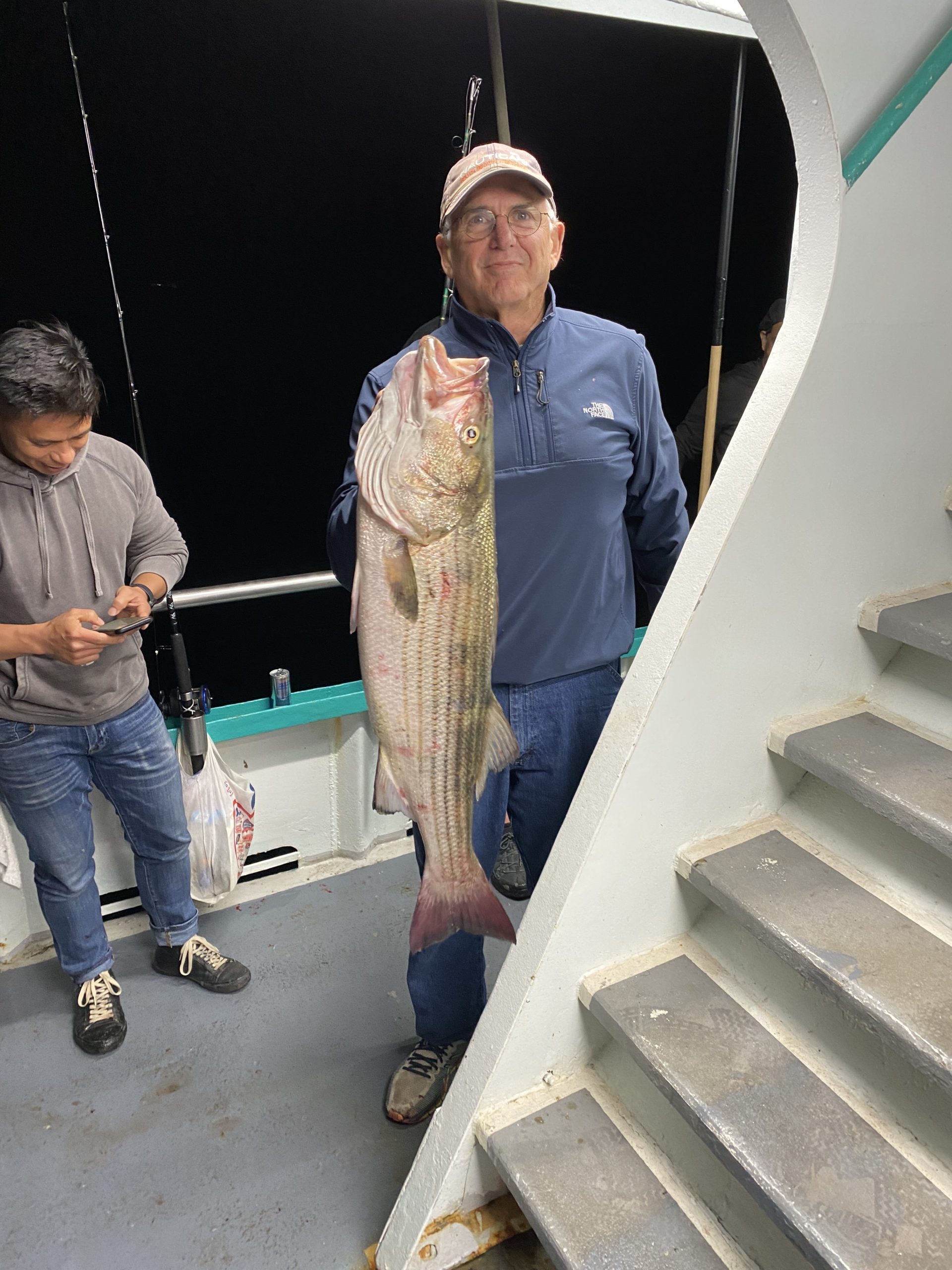 a man standing next to a woman
