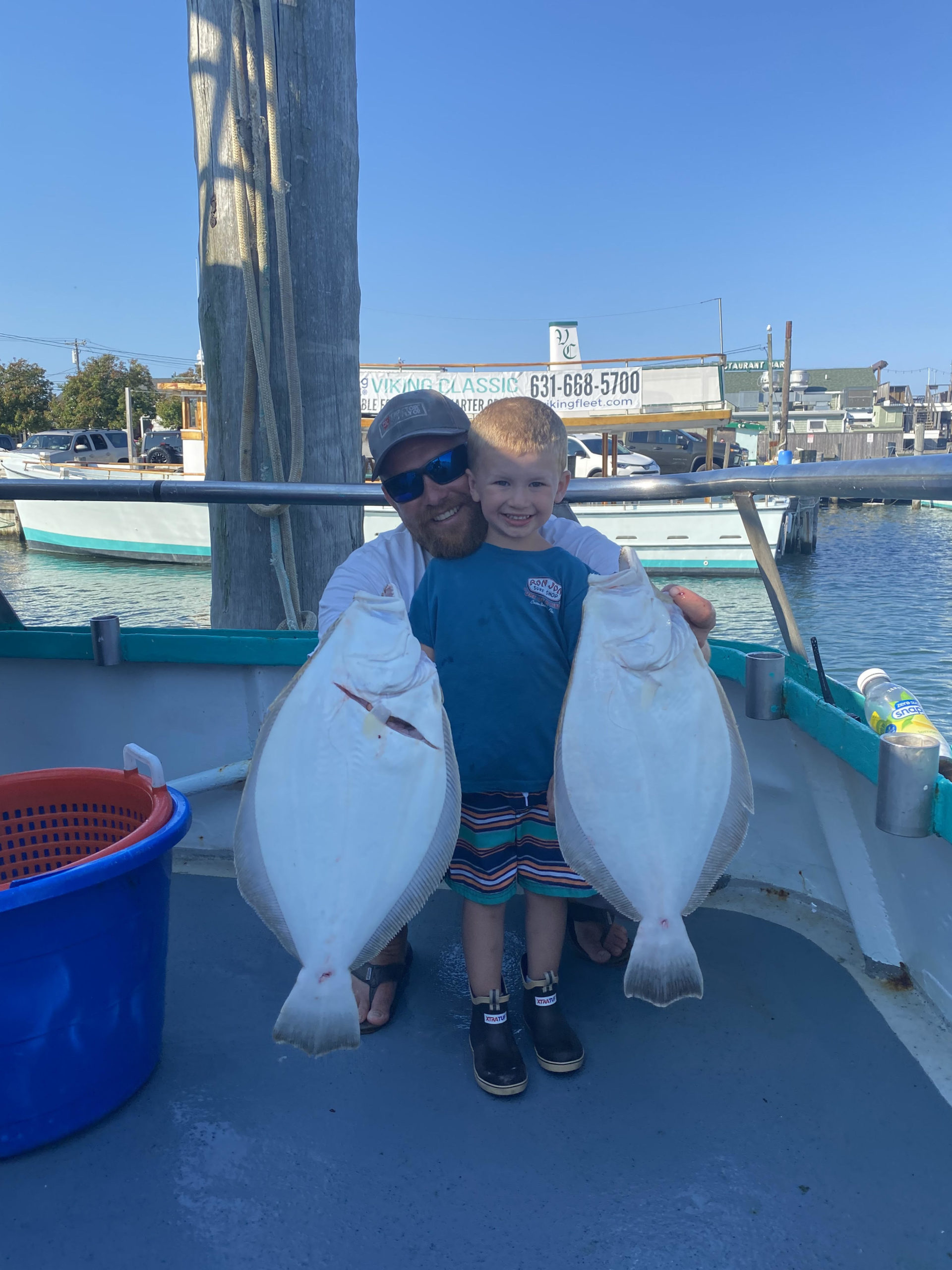 a person standing next to a body of water