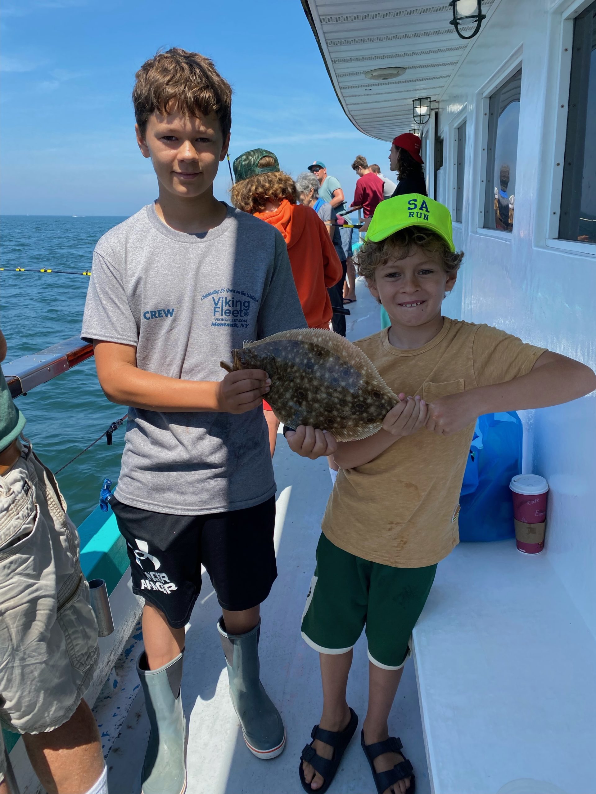 a person holding a fish in the water