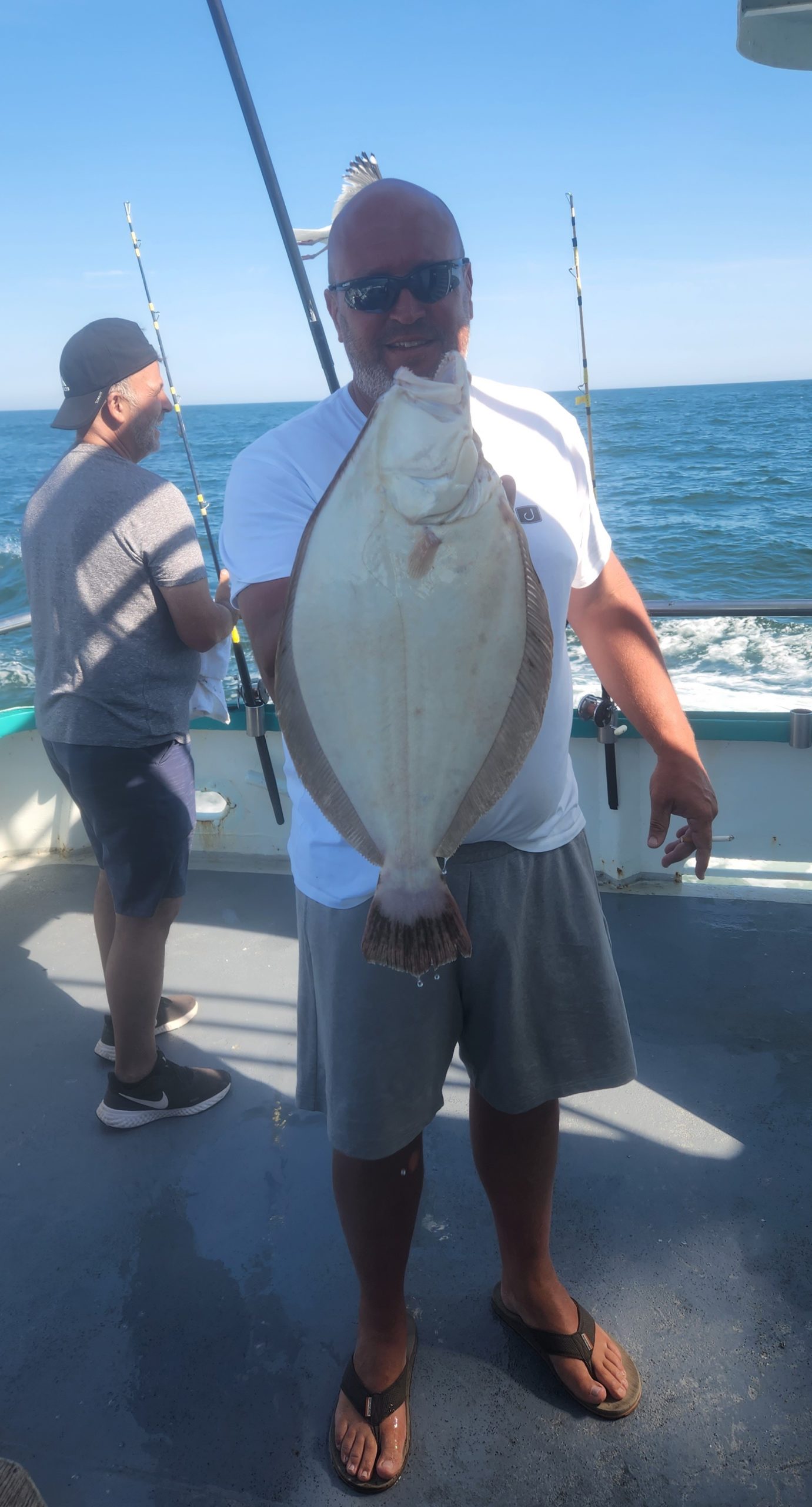 a person holding a fish in the water