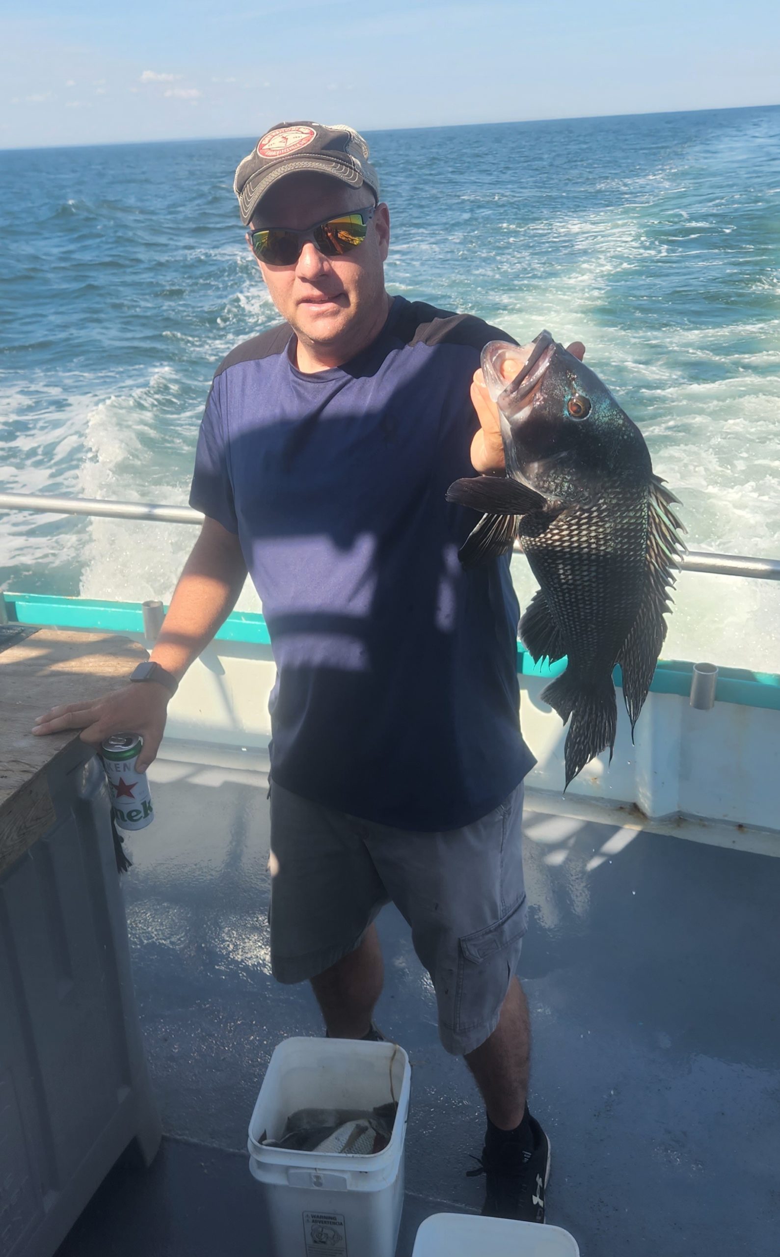 a person holding a fish in the water
