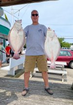 a man holding a fish