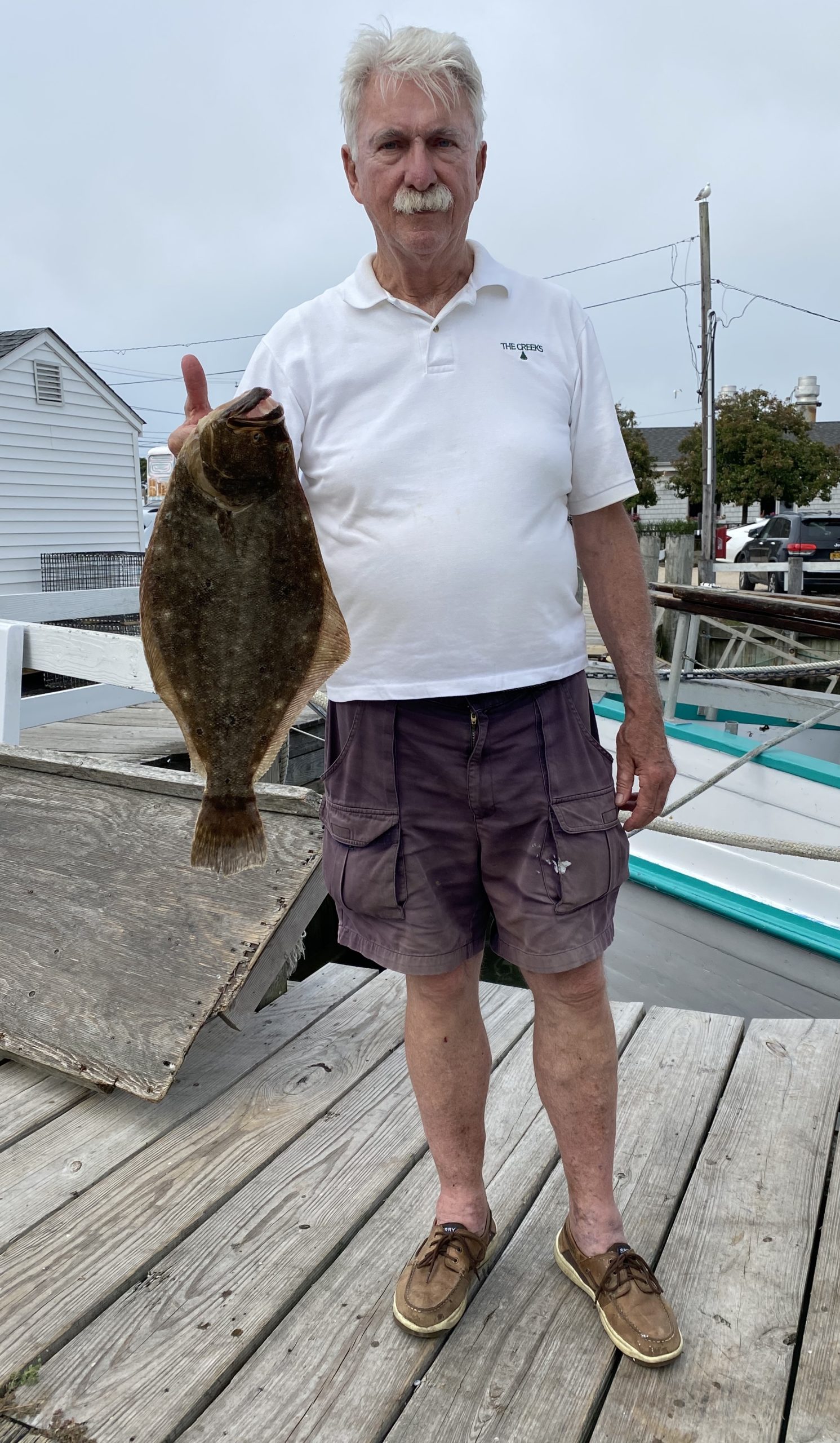 a man holding a fish