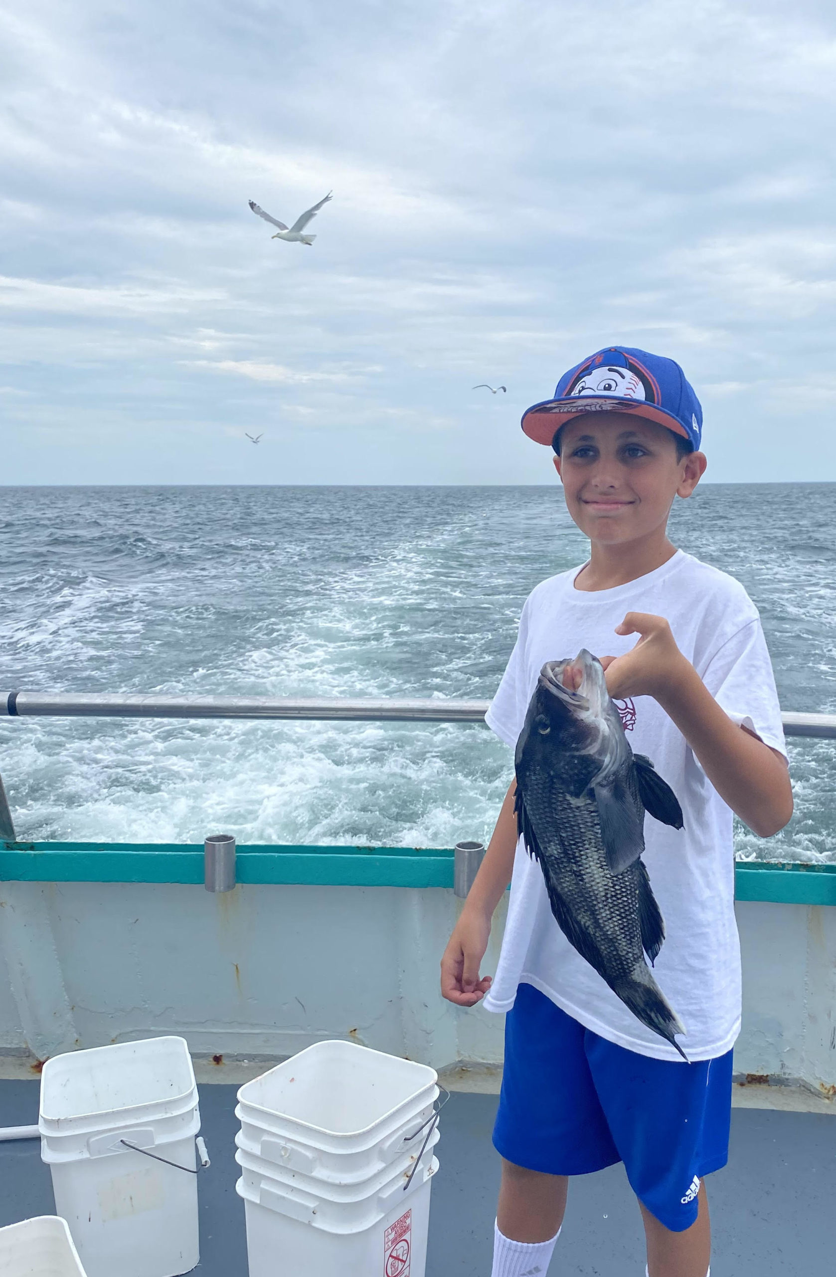 a man and a woman standing next to a body of water