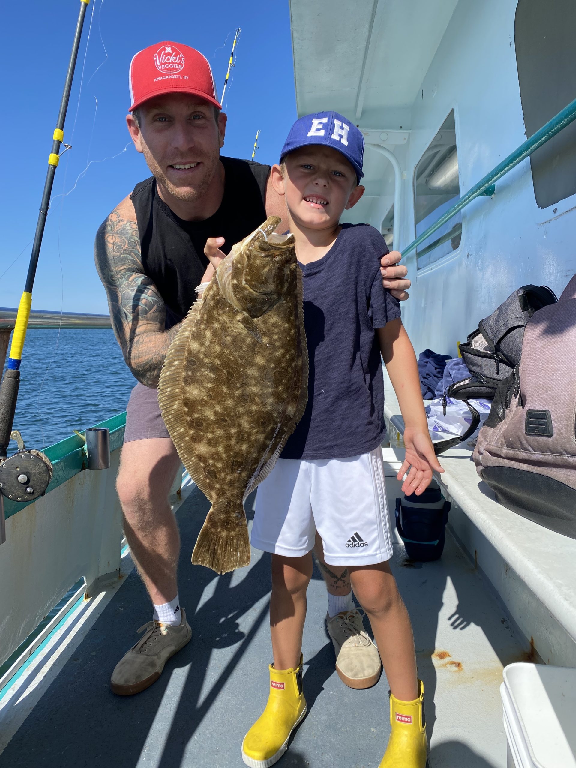 a man holding a fish