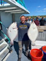 a man holding a fish