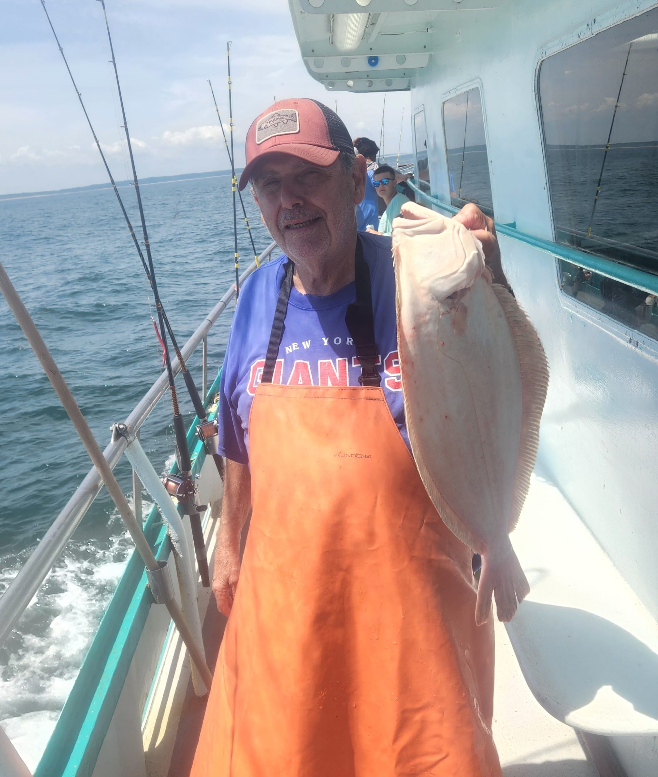 a person holding a fish in the water