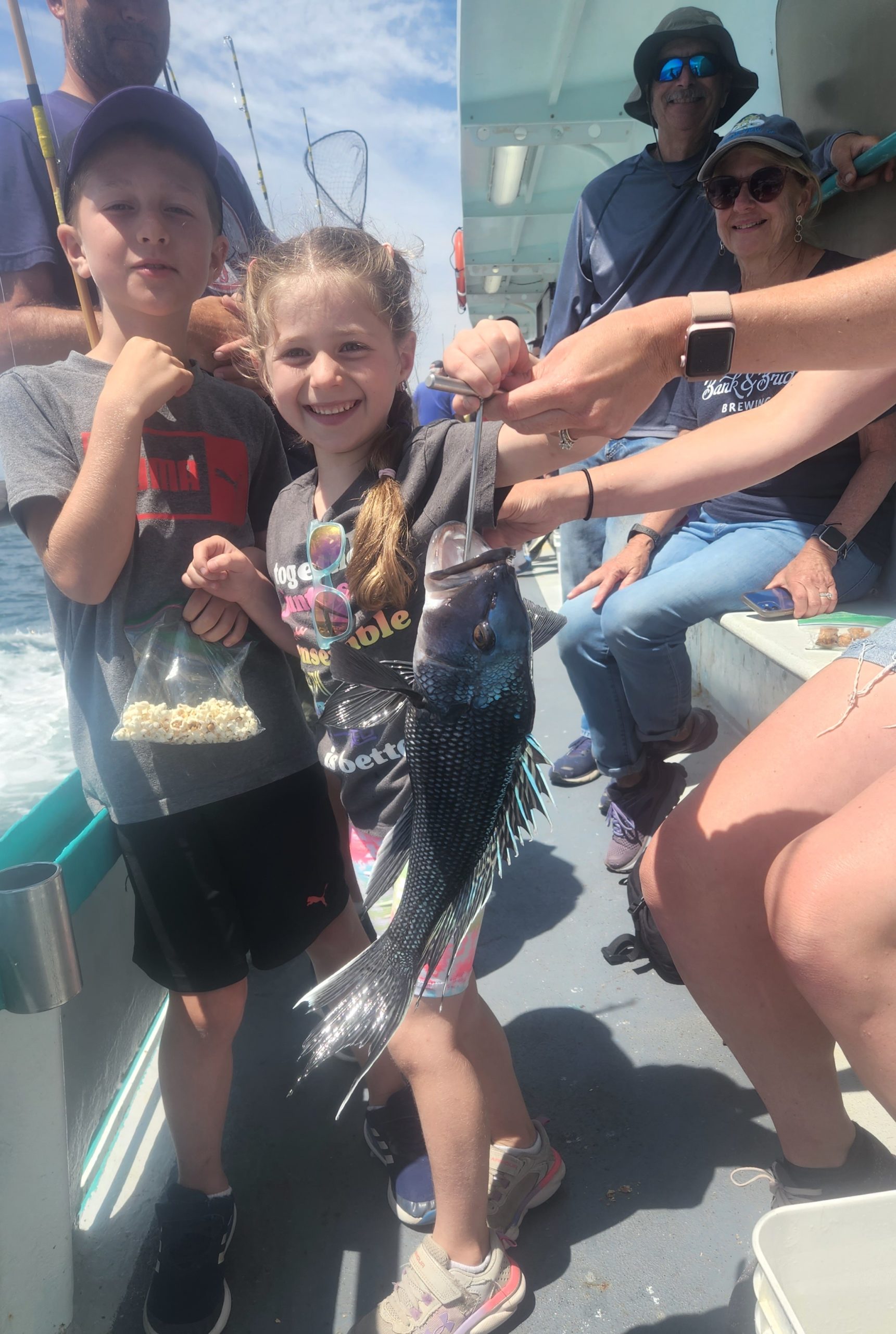a group of people sitting posing for the camera