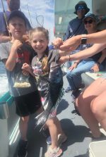 a group of people sitting posing for the camera