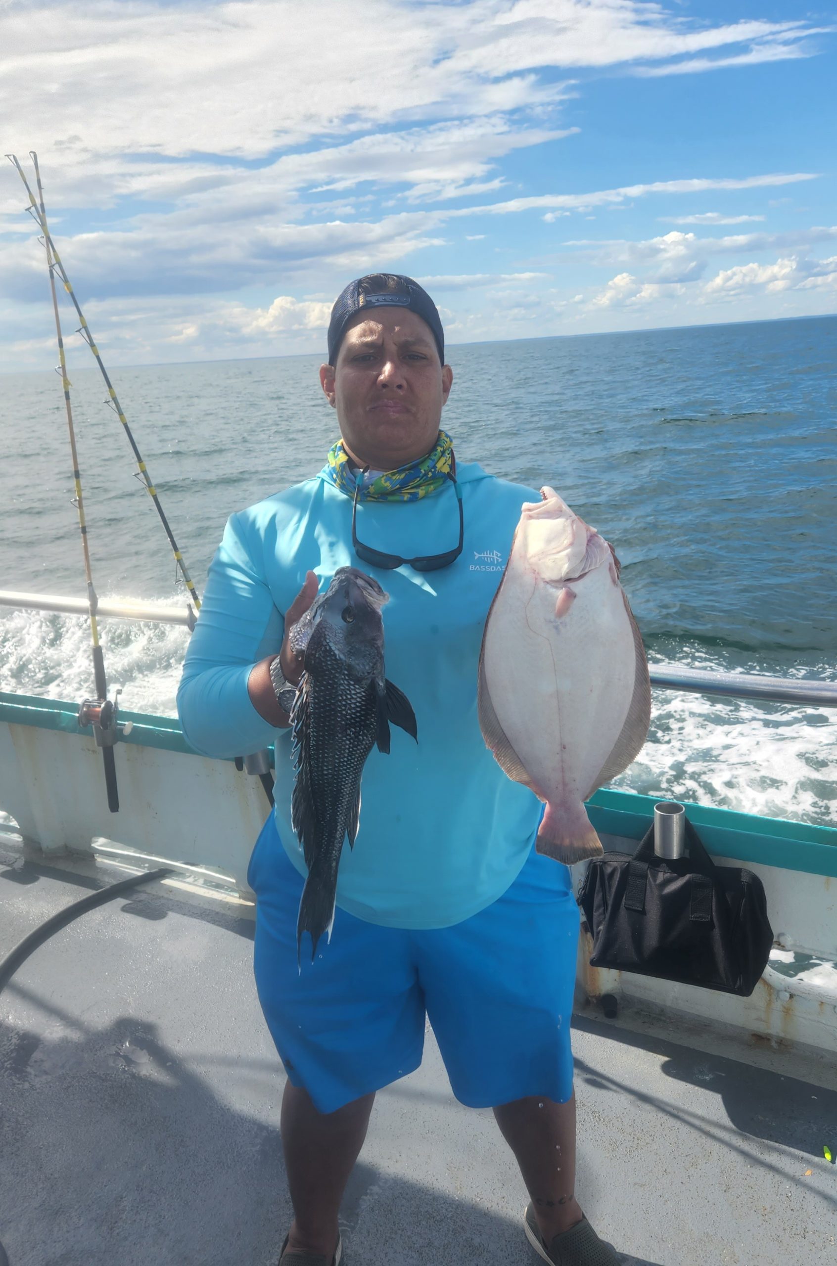 a person holding a fish in the water