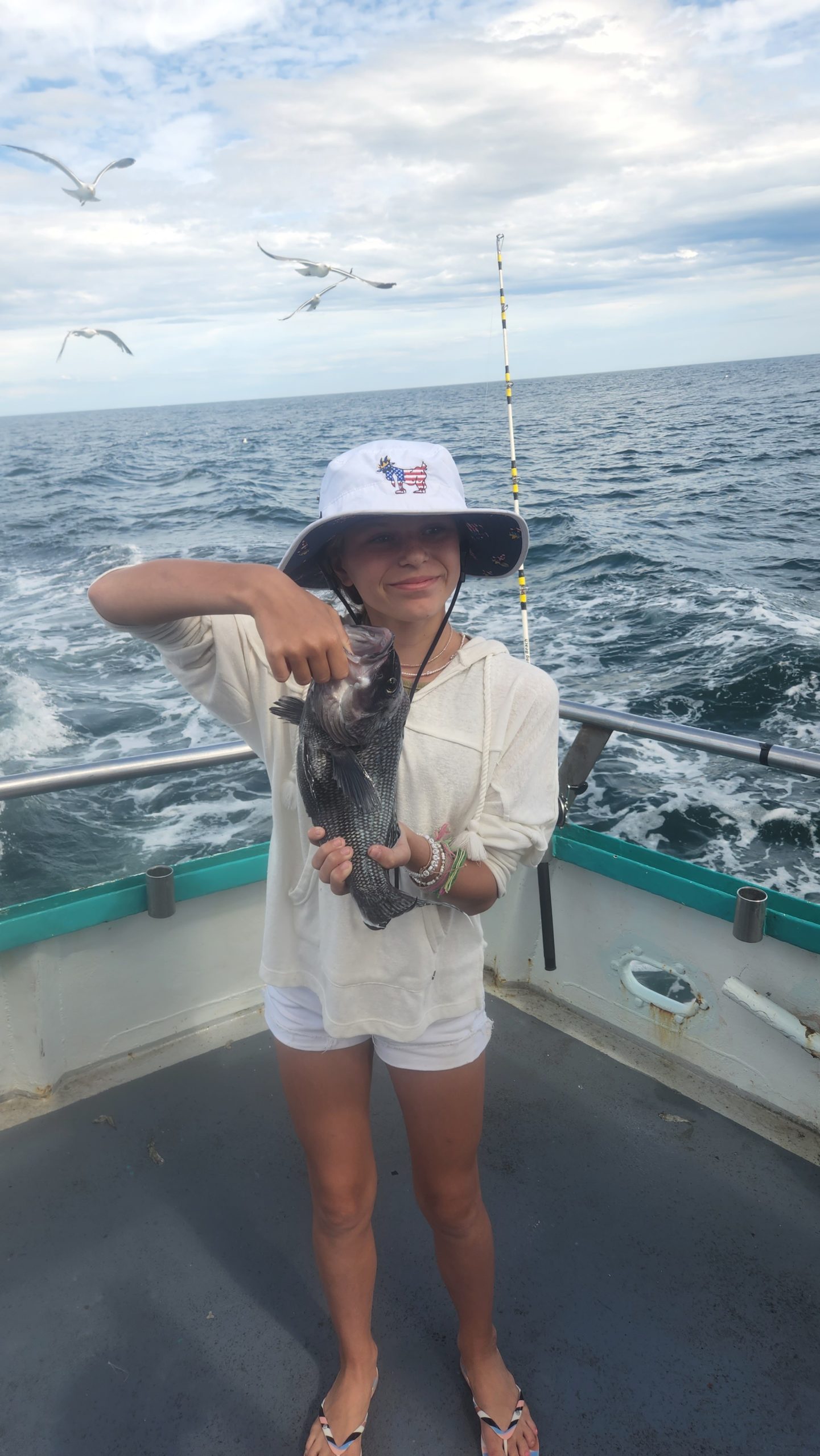 a person standing next to a body of water