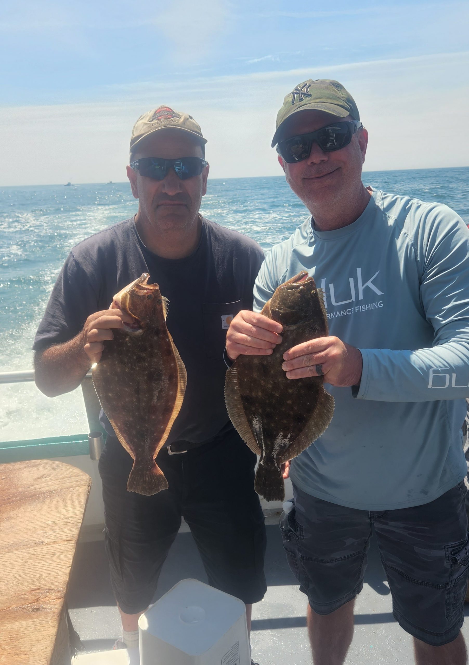 a person holding a fish in the water