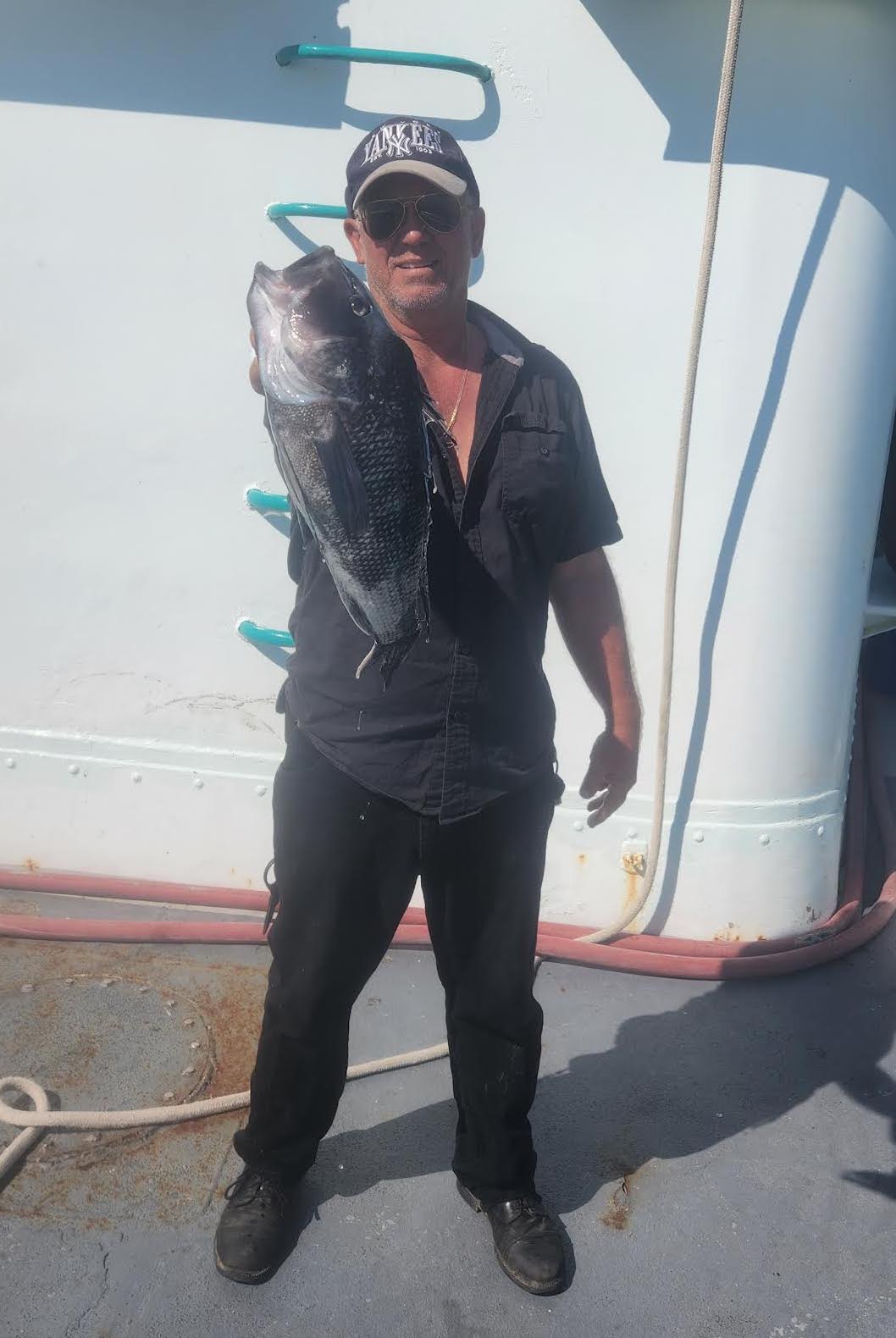 a person holding a fish