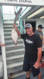 a man holding a fish