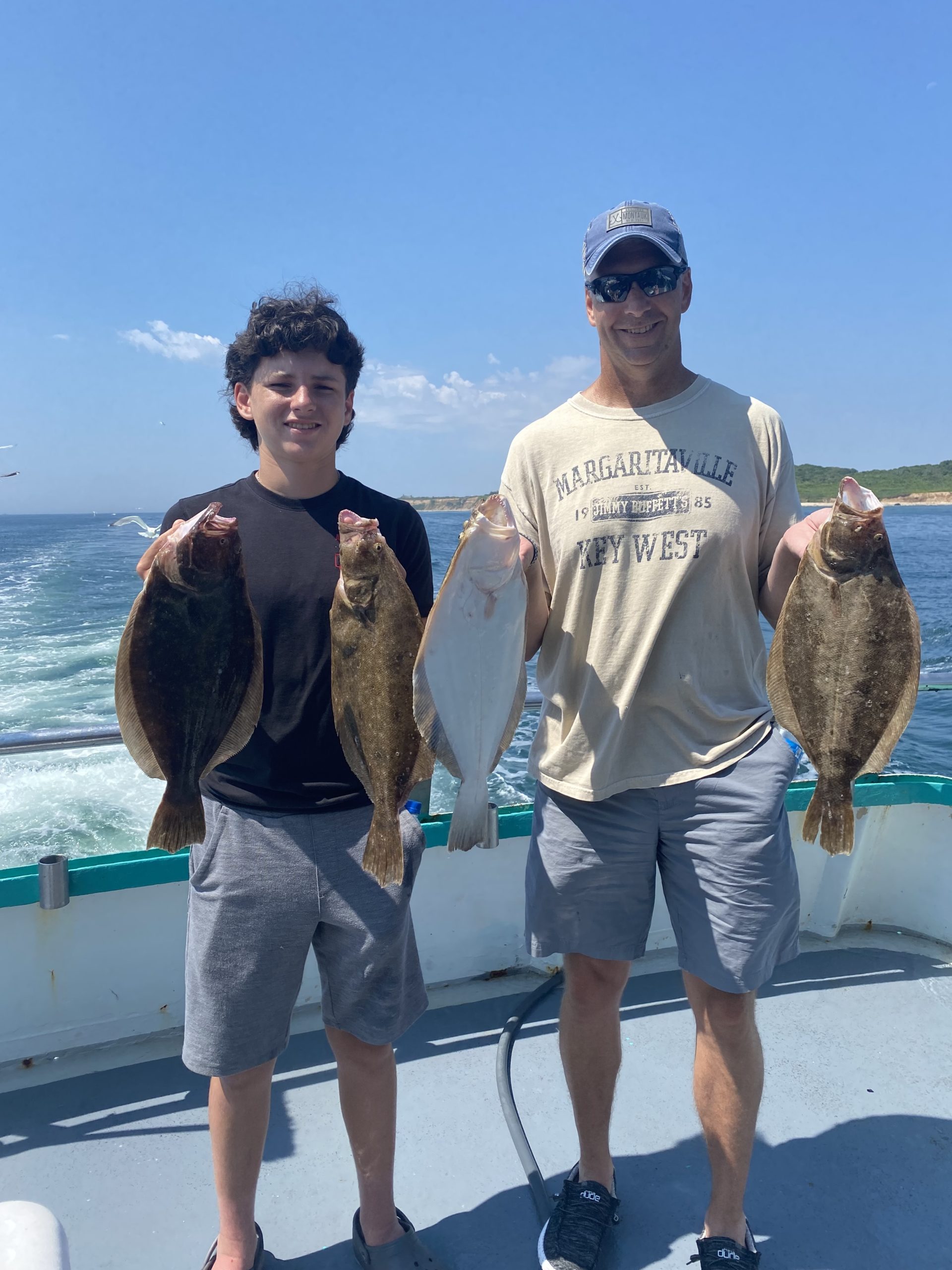 Ross Hill holding a fish in the water