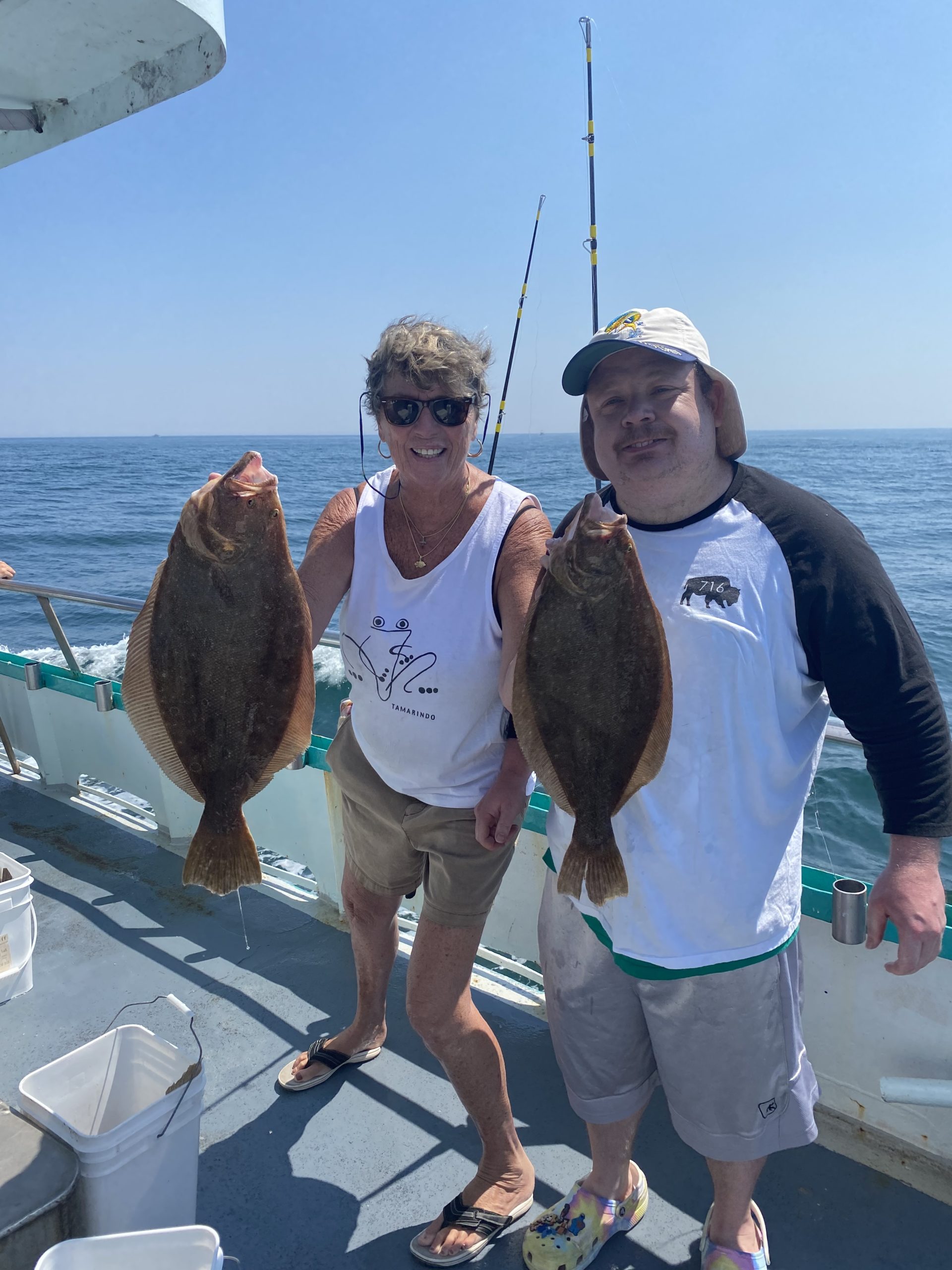 a person holding a fish in the water