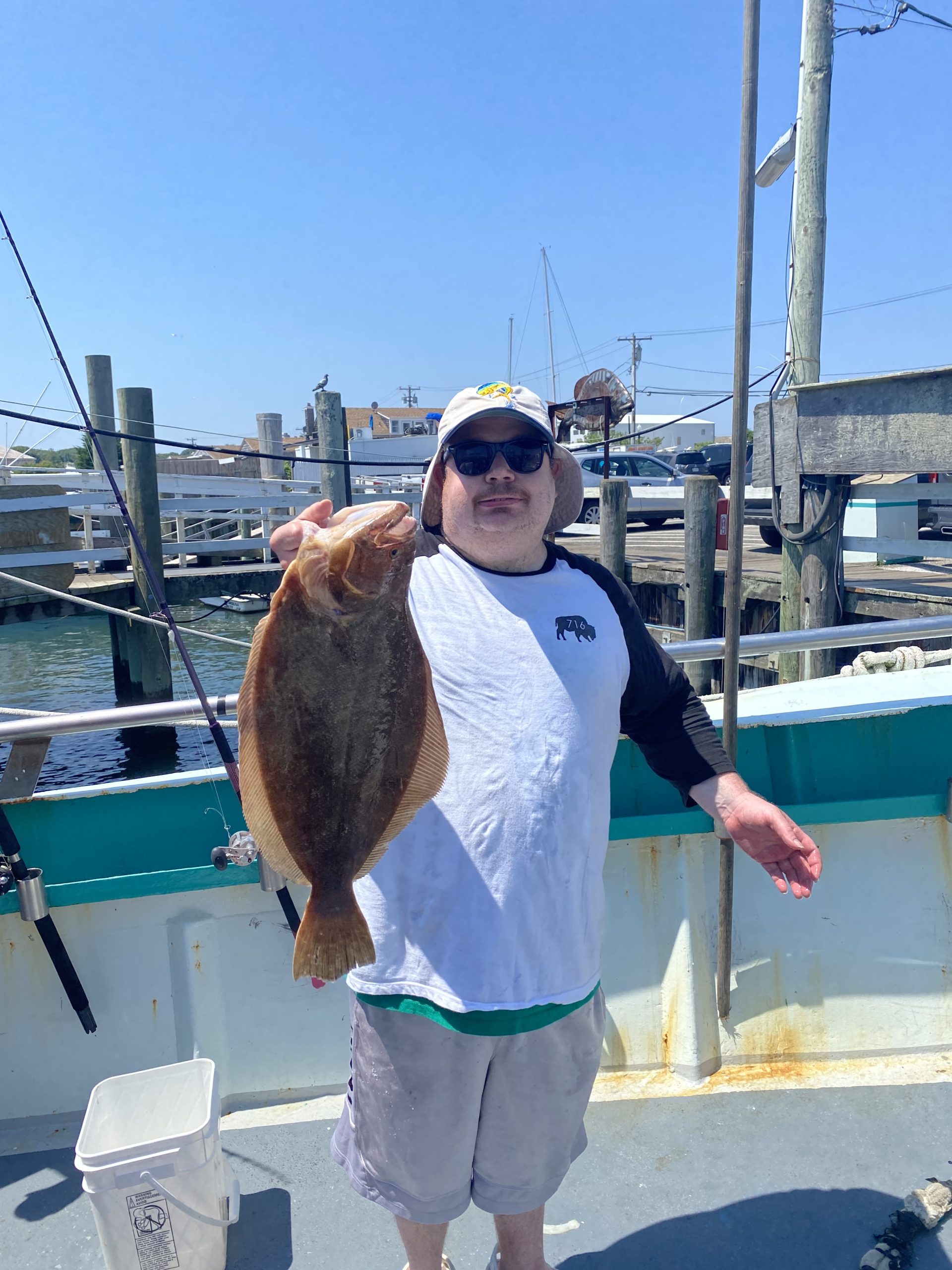 a man holding a fish