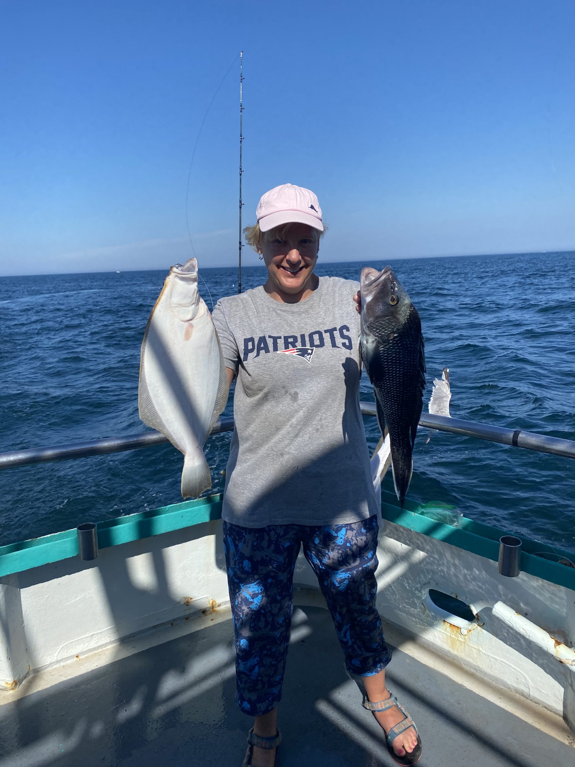 a person standing next to a body of water