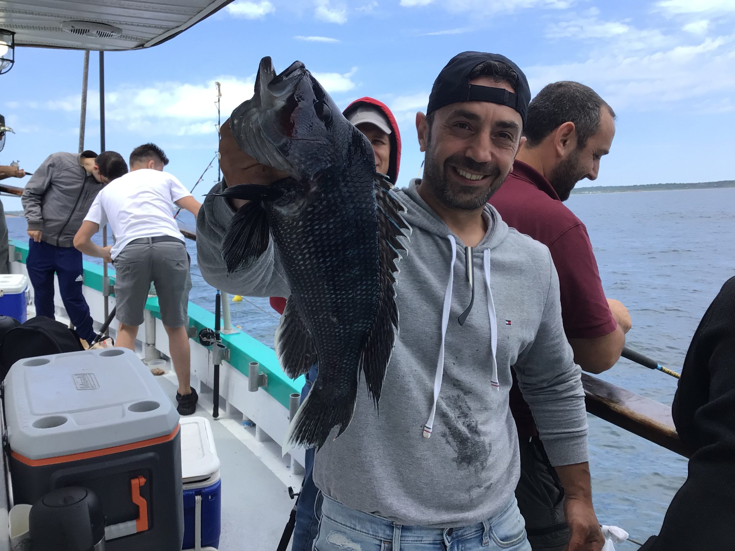 a group of people standing on a boat