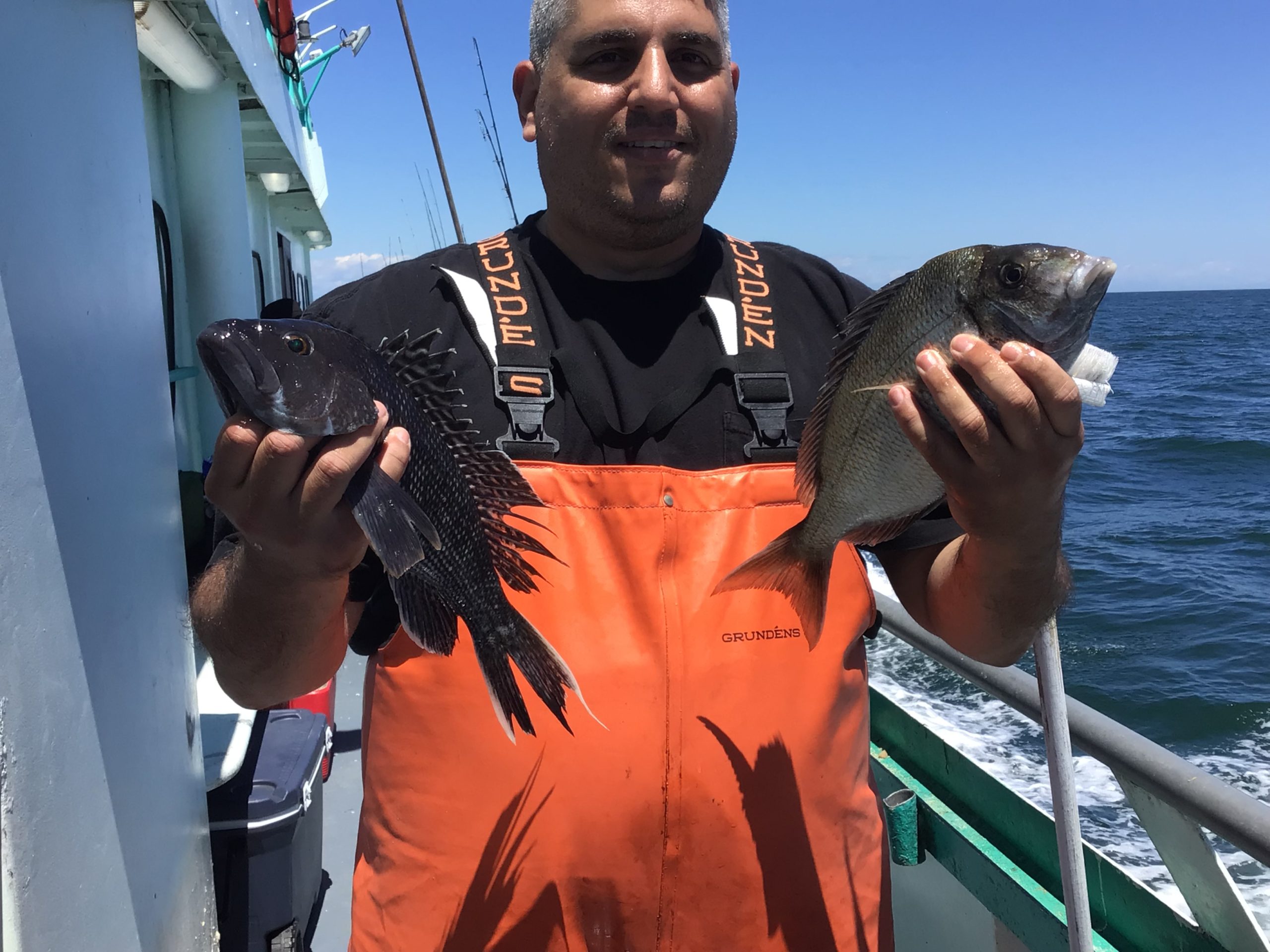 a man holding a fish