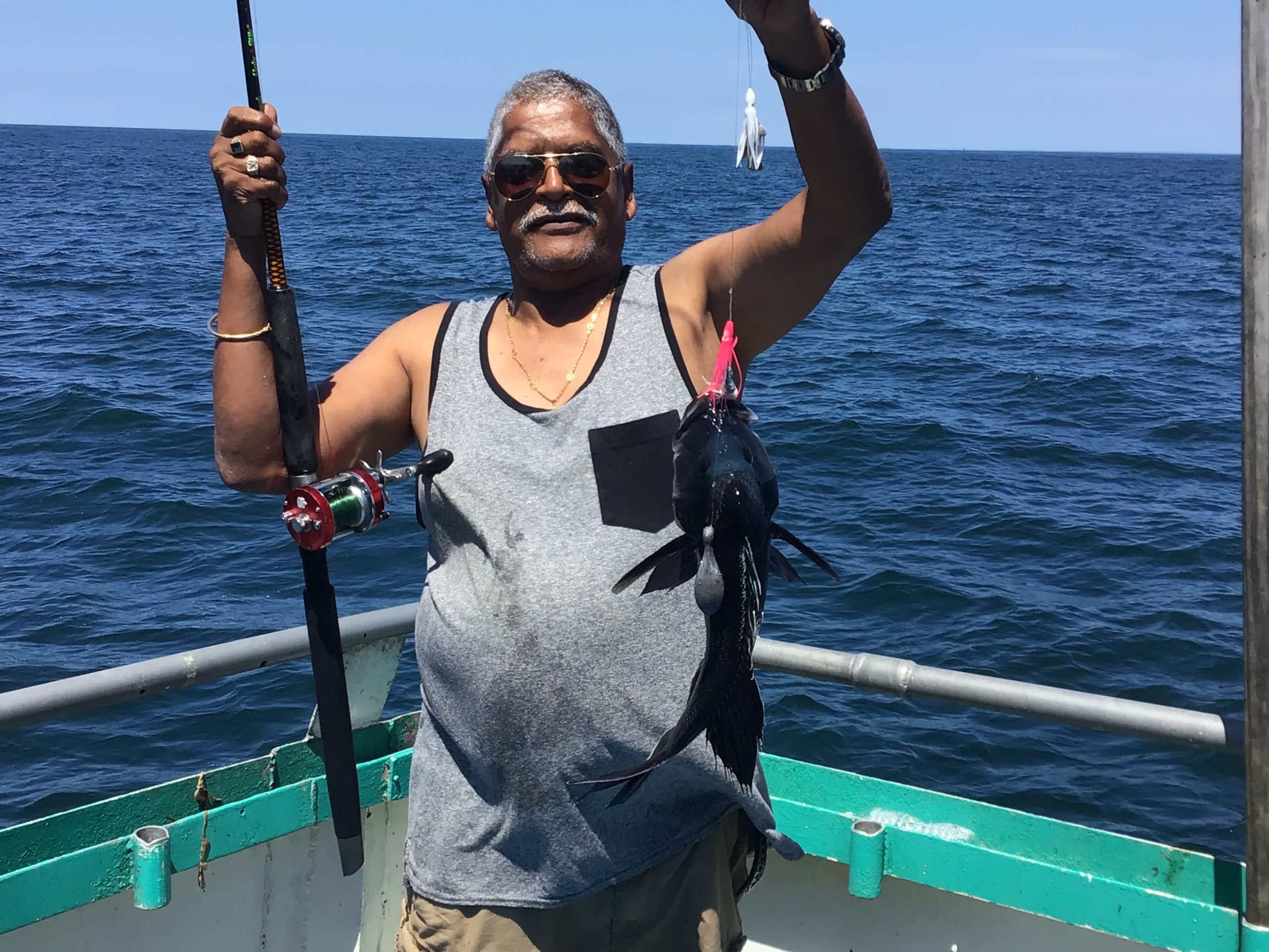 a person standing next to a body of water