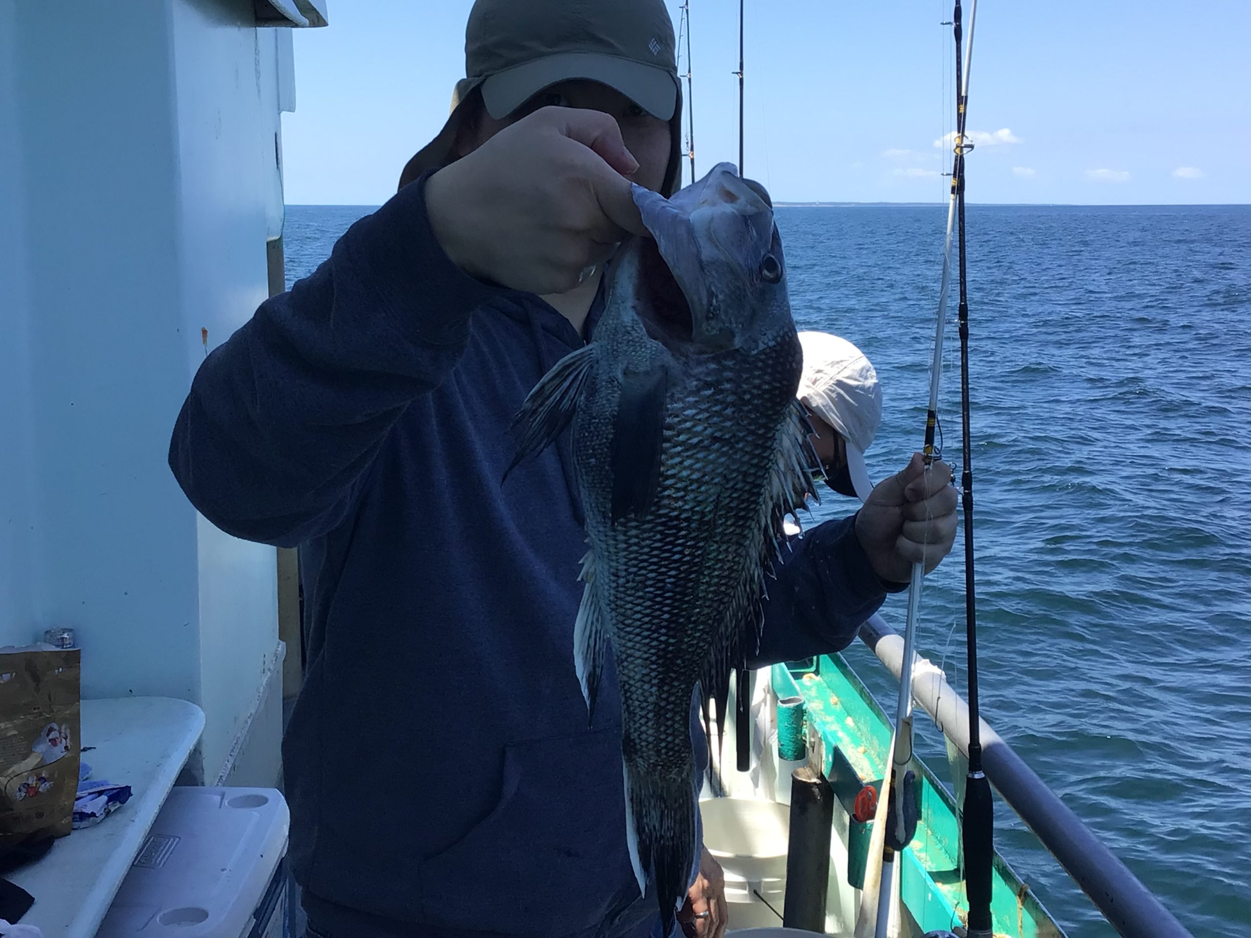 a person holding a fish in the water