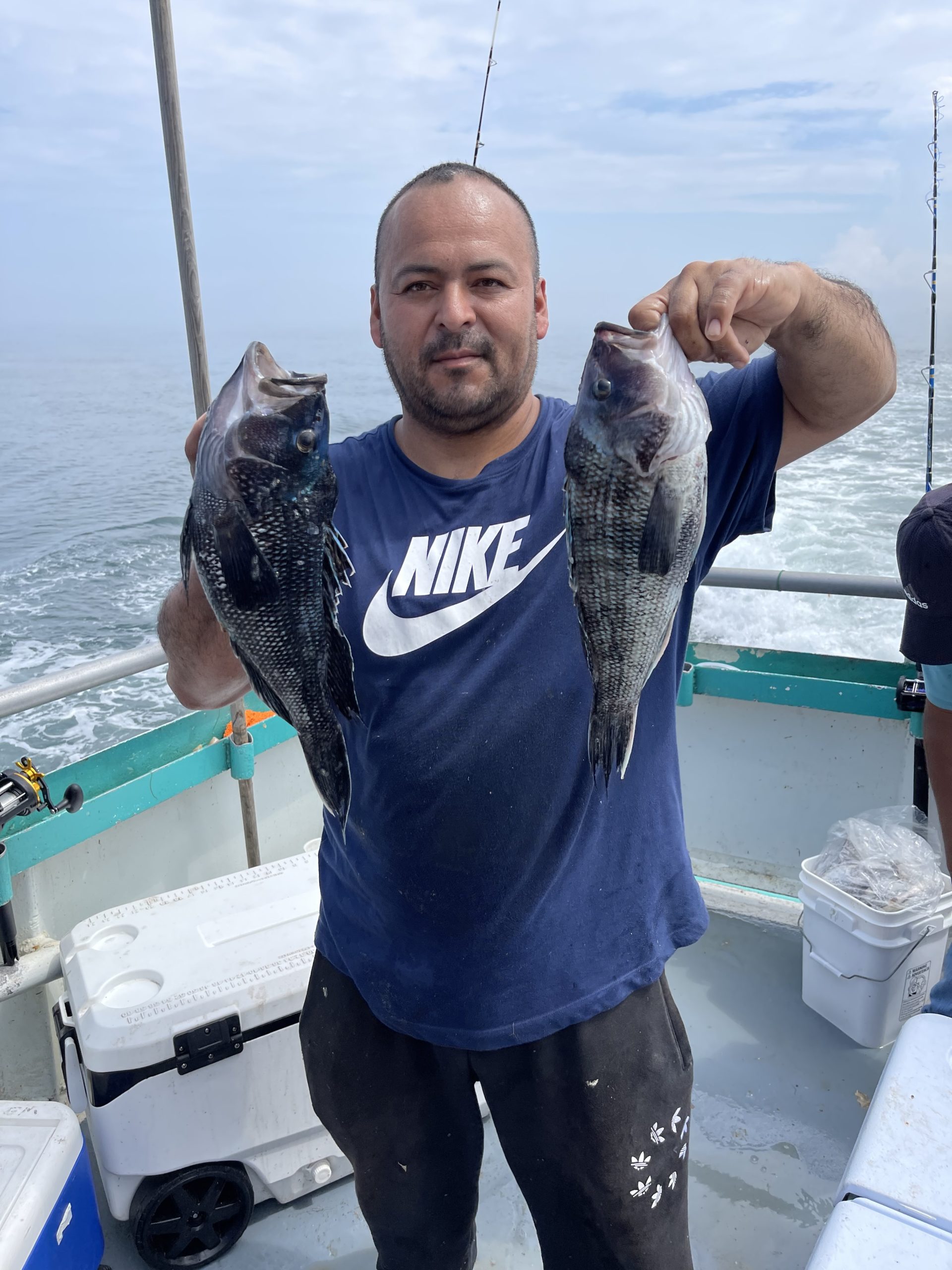 a person holding a fish in the water