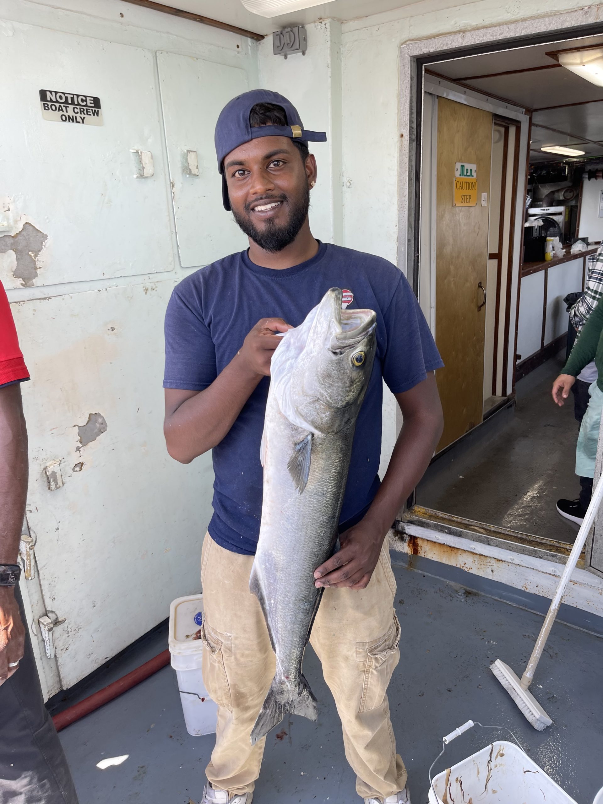 a man holding a fish