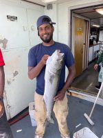 a man holding a fish