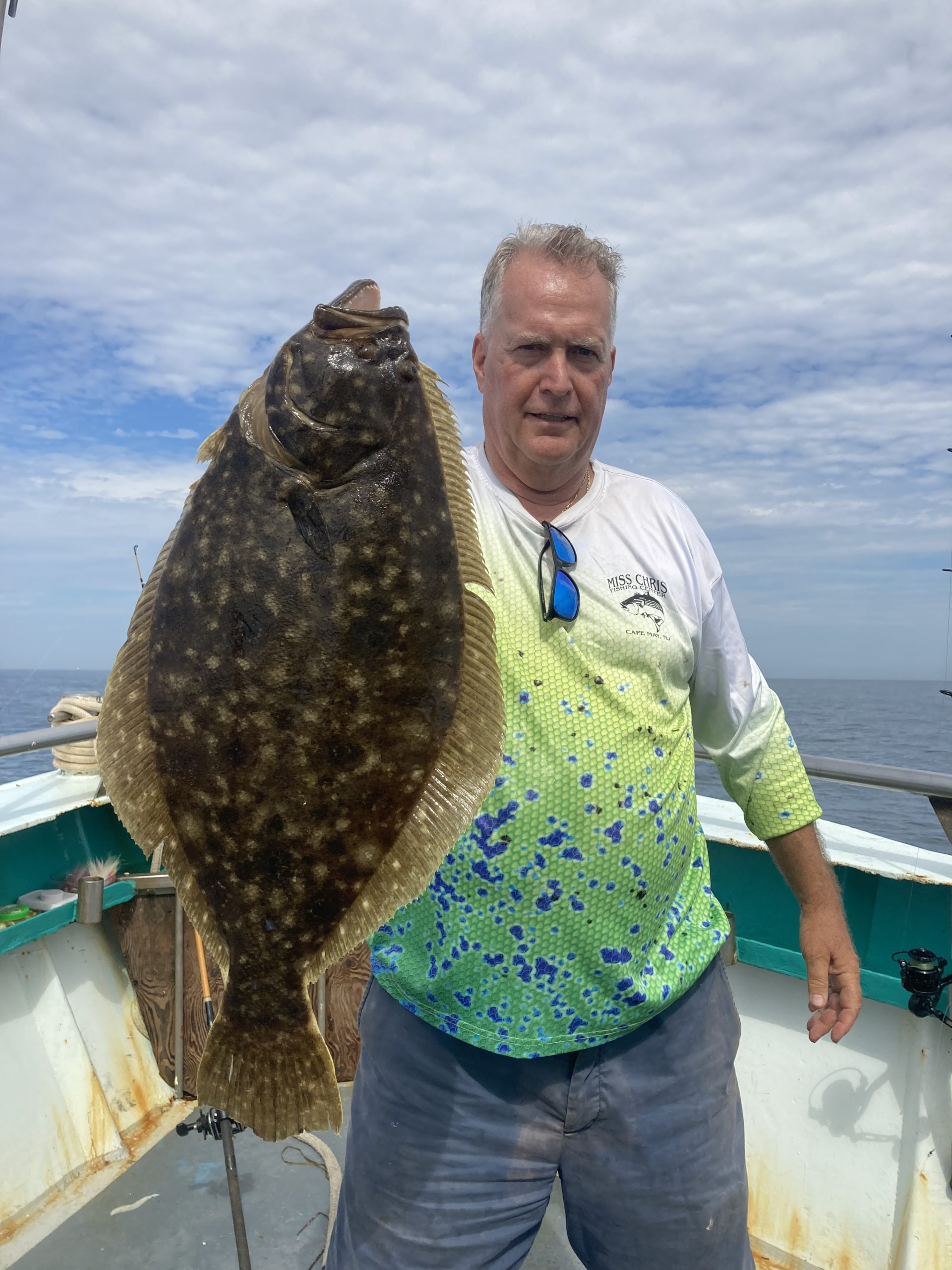 a man holding a fish