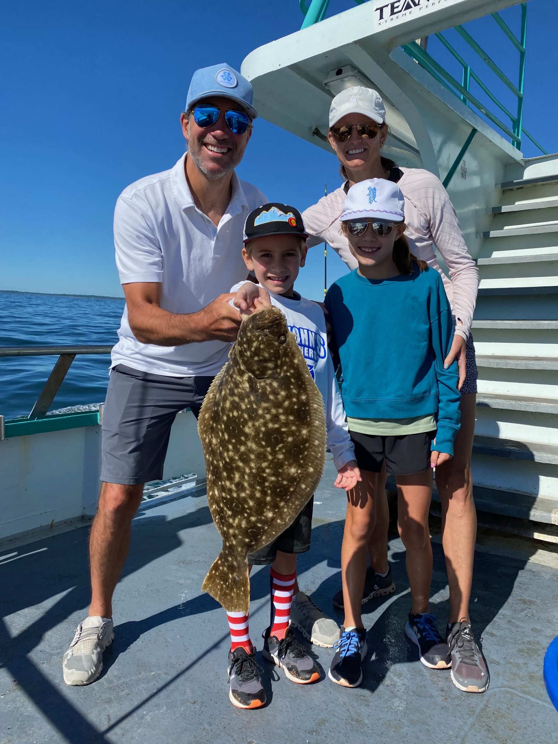 a man holding a fish