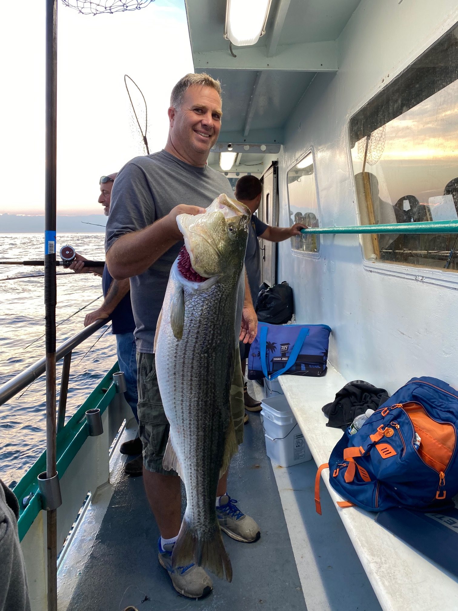 a man holding a fish