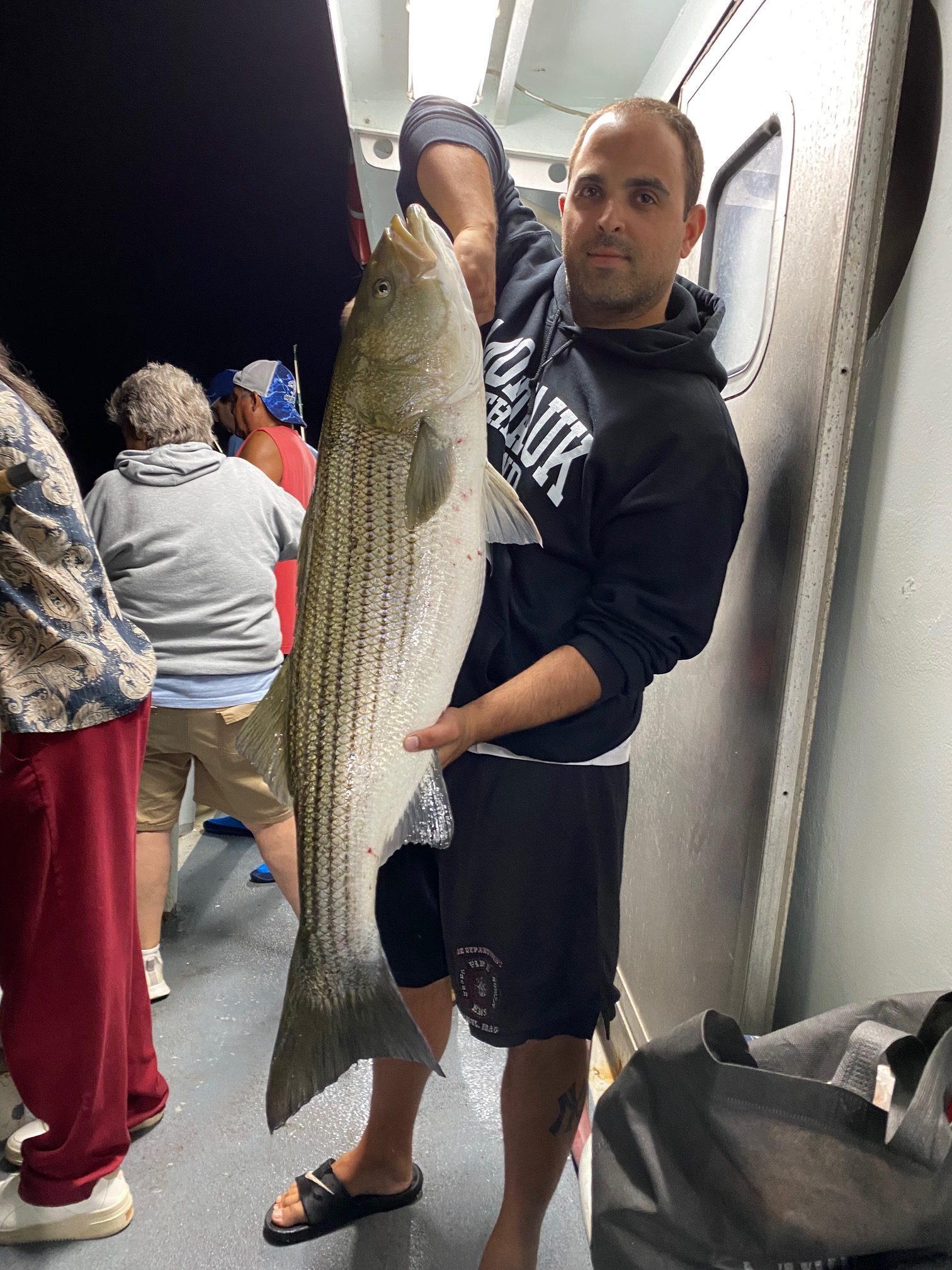 a person holding a fish