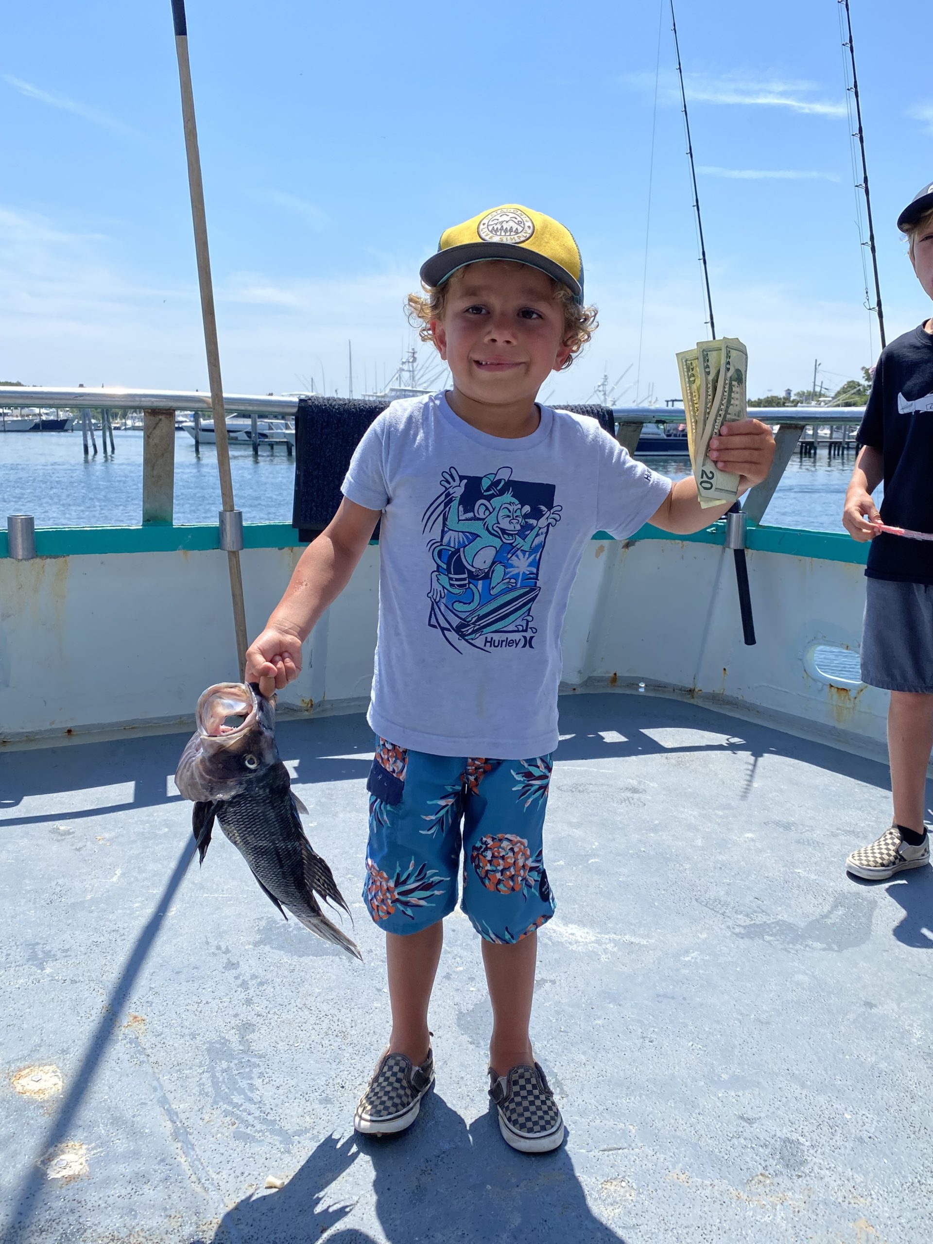 a little boy that is standing in the water